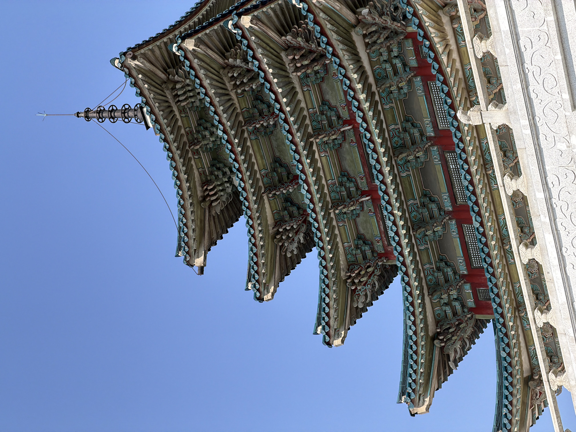 Traditional Korean architecture photographed alongside modern buildings in Seoul