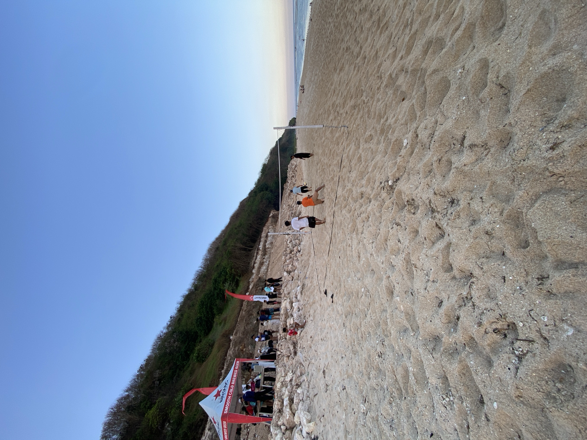 Beach afternoon in Kuta Selatan with volleyball, shells, and selfies