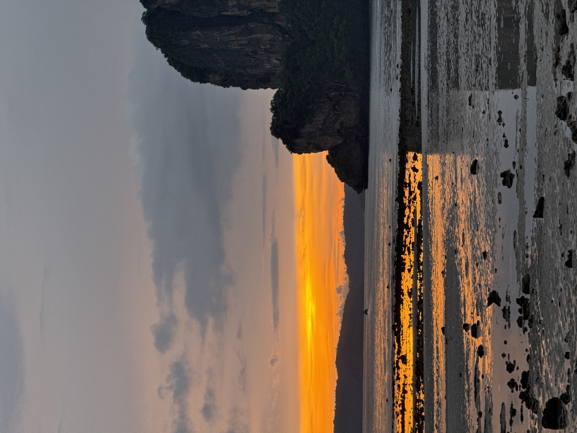 Limestone cliffs and low tide at Ban Ao Nang sunset