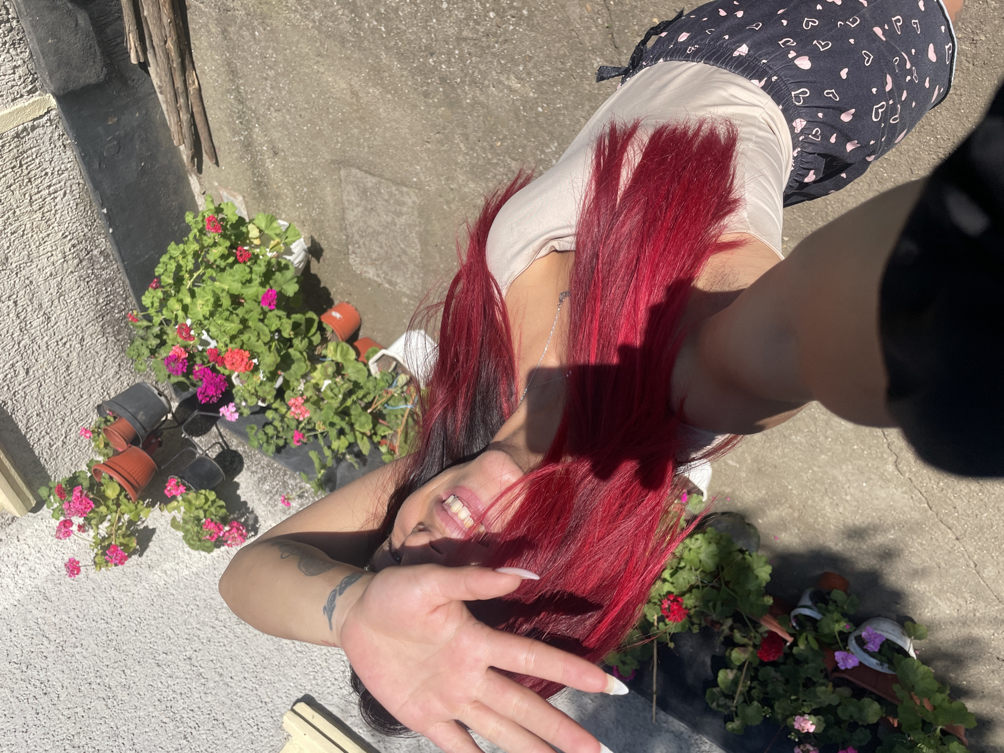 Candid courtyard shoot with red hair and a clay oven, Bulgaria