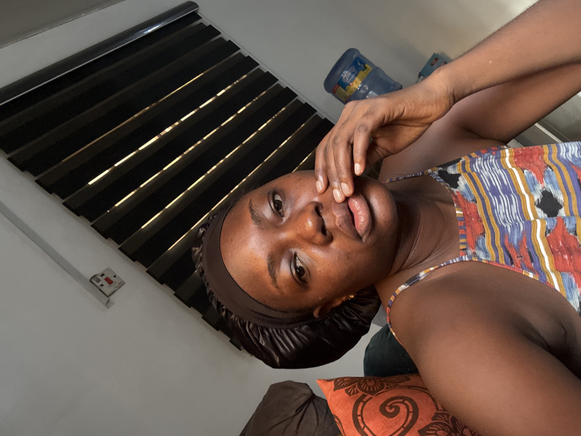 Woman takes morning selfies in Abuja home