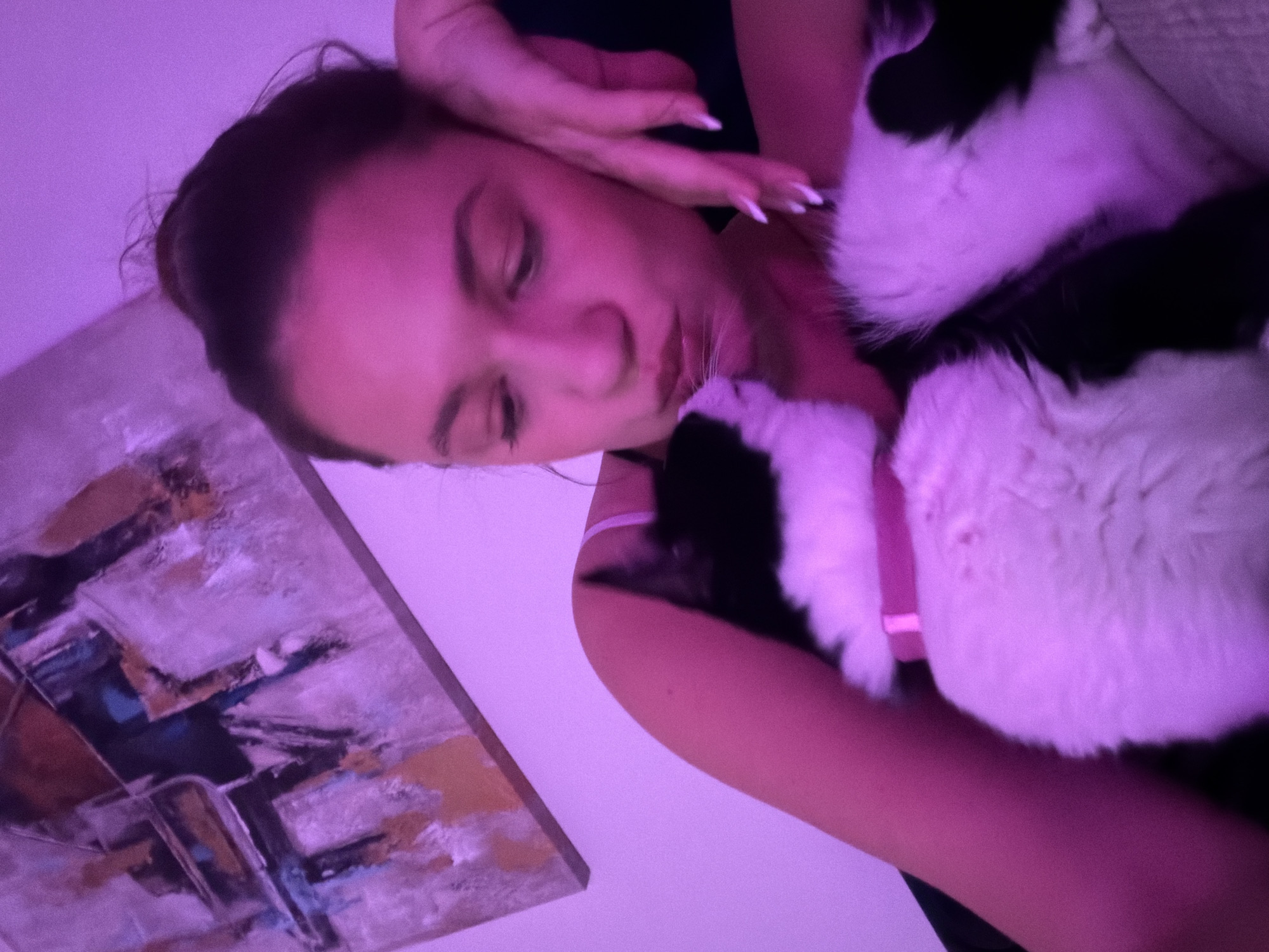 Woman shares quiet moments with black and white cat in Belgrade
