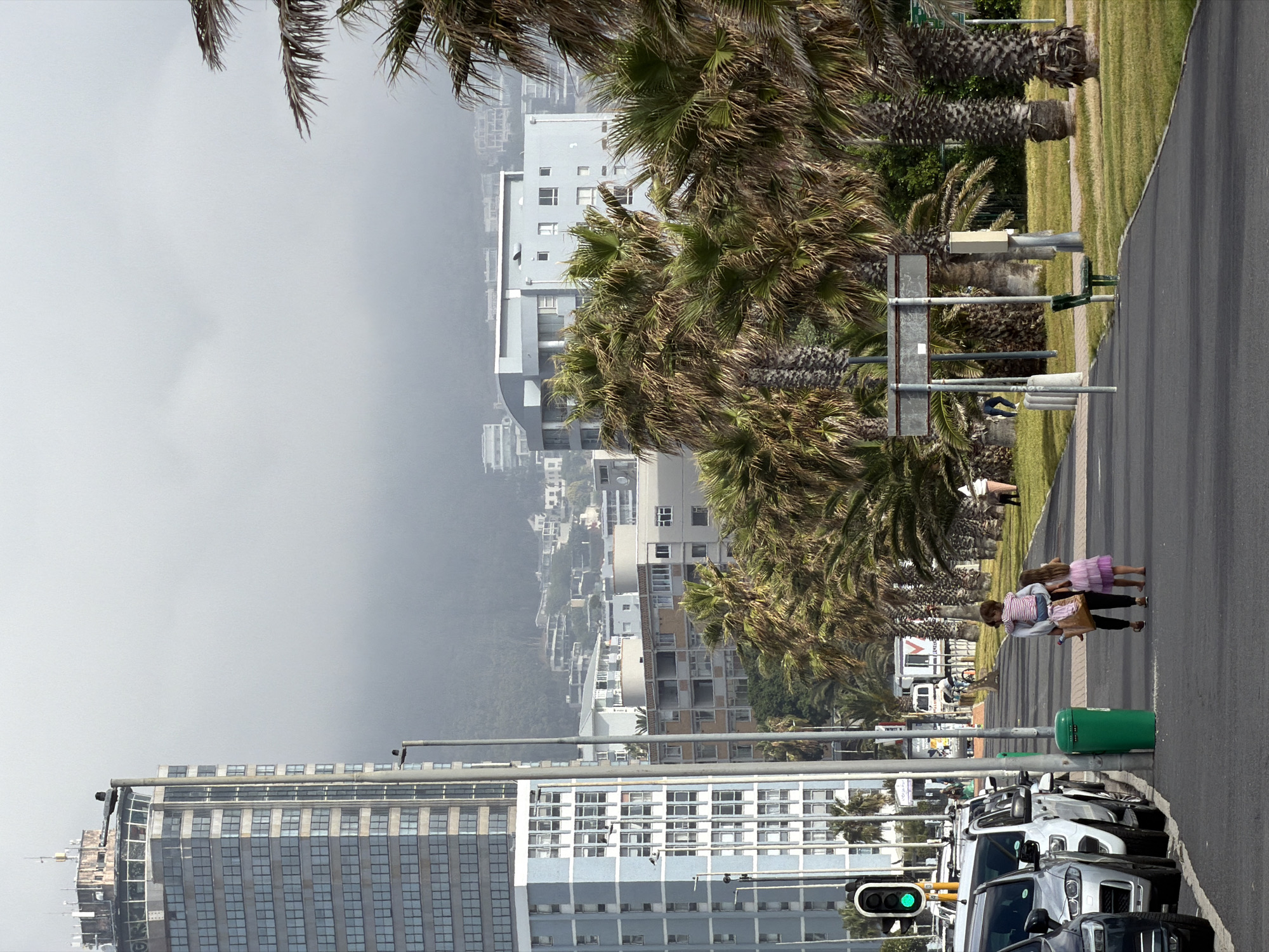 Ordinary weekend life unfolds along Cape Town's coastal promenade
