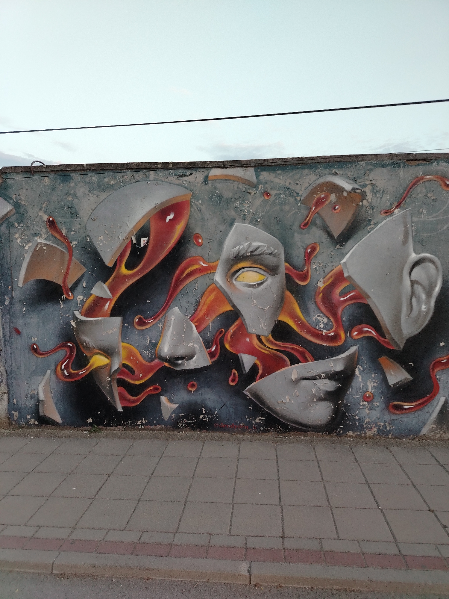 Graffiti-covered walls in Novi Sad span letters, abstracts, and murals
