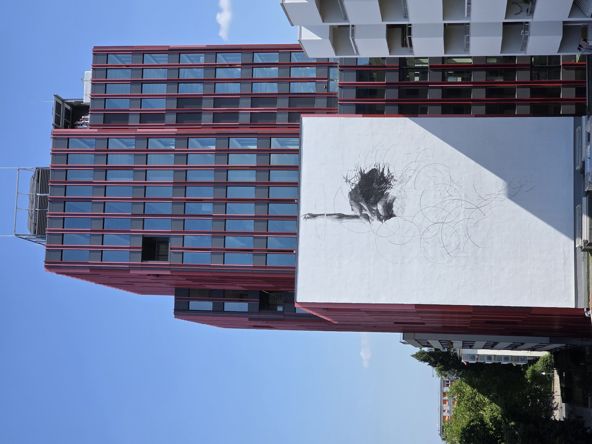 Police presence outside a Berlin cafe amid bold modern architecture