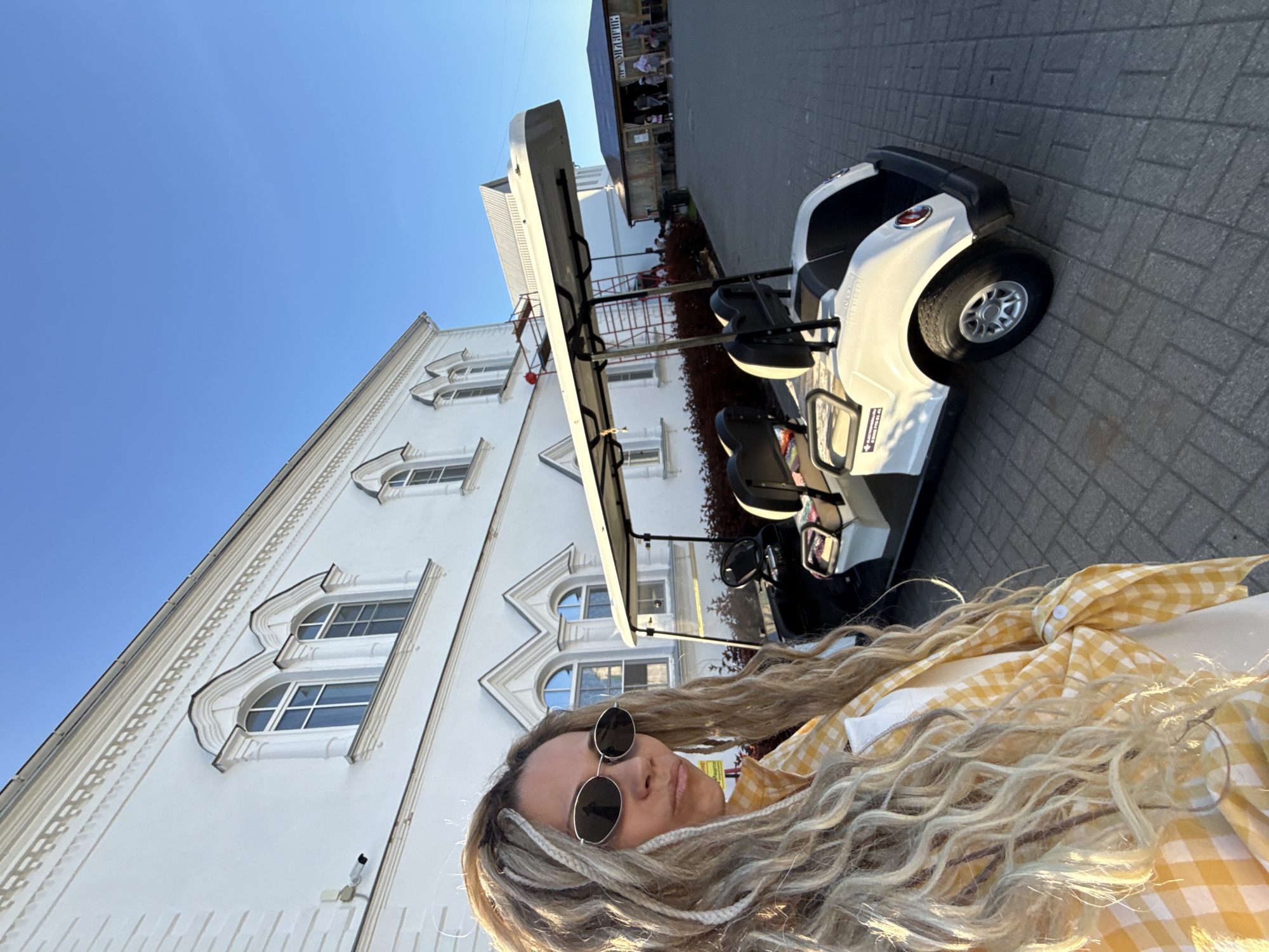 Woman photographed at multiple Yaroslavl locations during afternoon outing