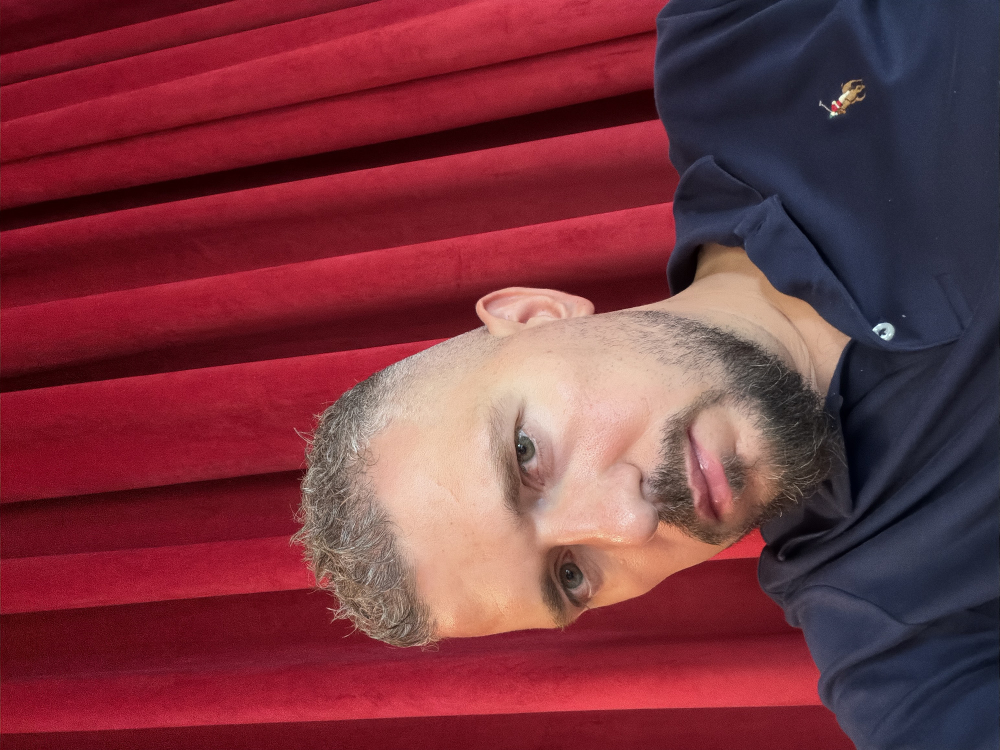Selfies and downtime shots at a Dubai venue with red velvet curtains