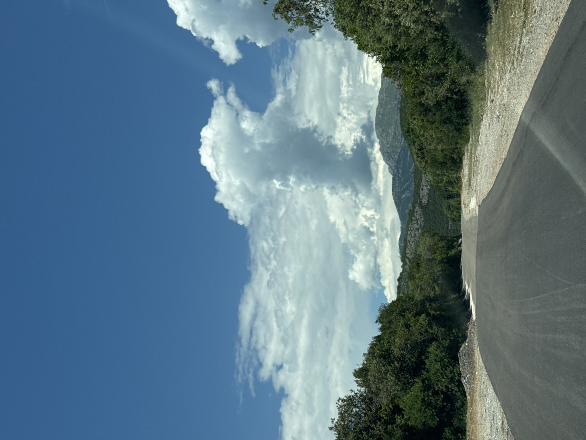 Mountain road and rocky shoreline in coastal Montenegro