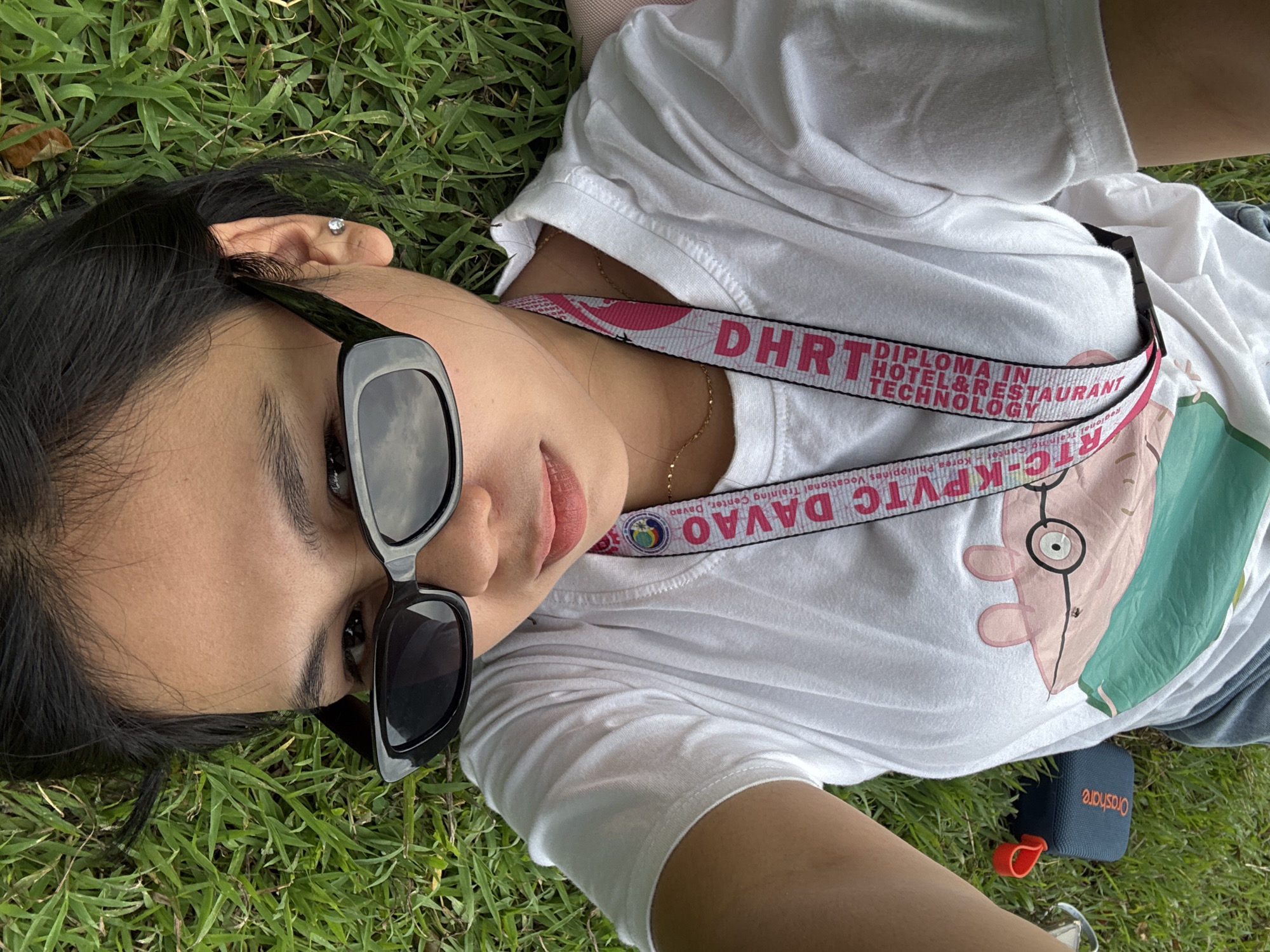 Lazy morning hangout on a Davao City grassy field with a dachshund