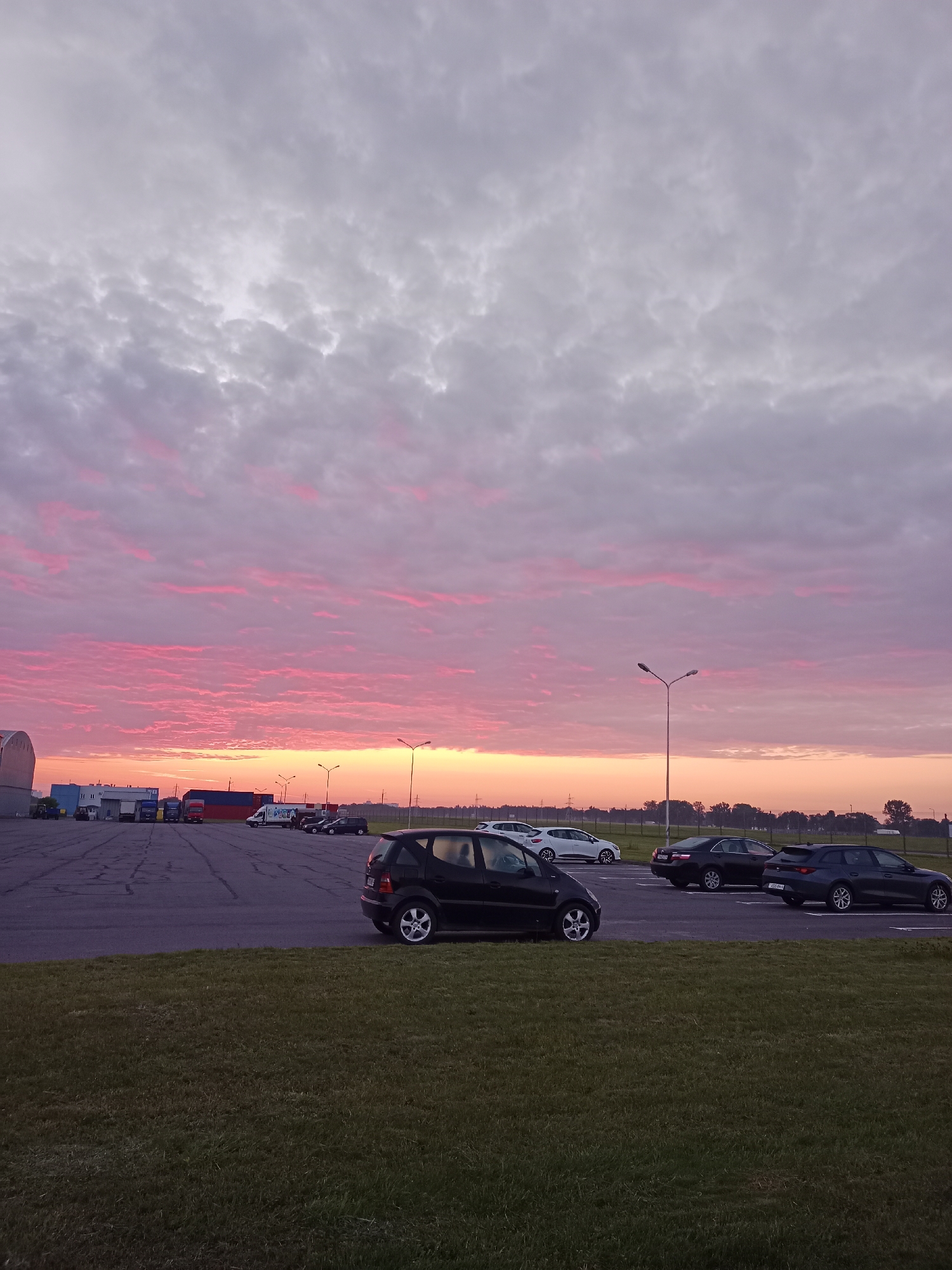Vivid dusk sky over a Belarusian parking lot