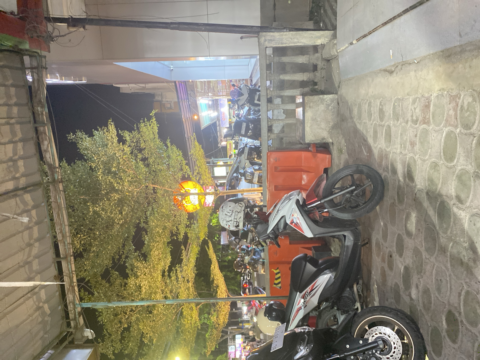 Evening grocery run at a Banda Aceh warung, frozen snacks in focus