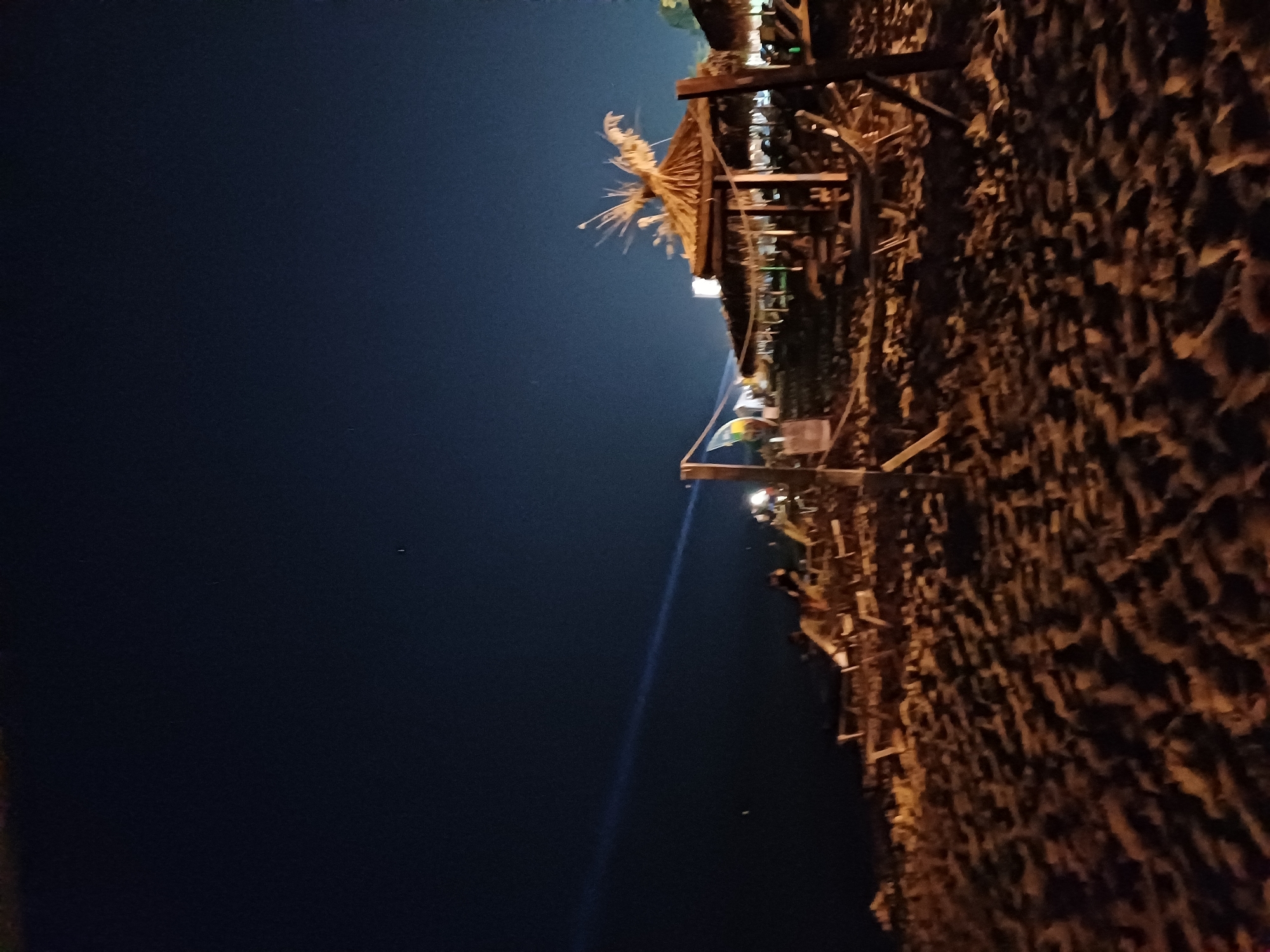 Summer night on Varna's beach: lanterns, loungers, and a crowd