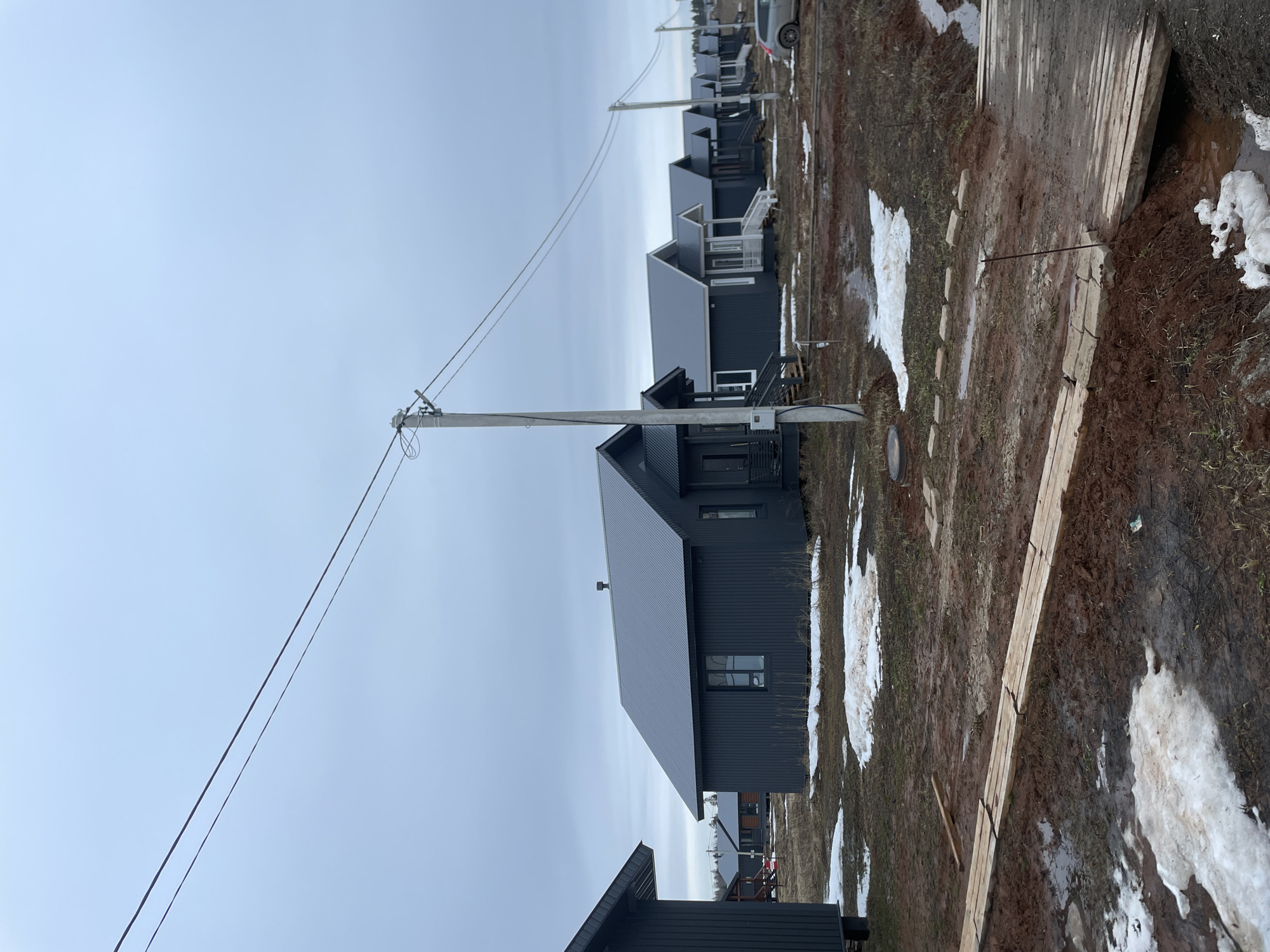 Spring day documented in Russian village with new construction