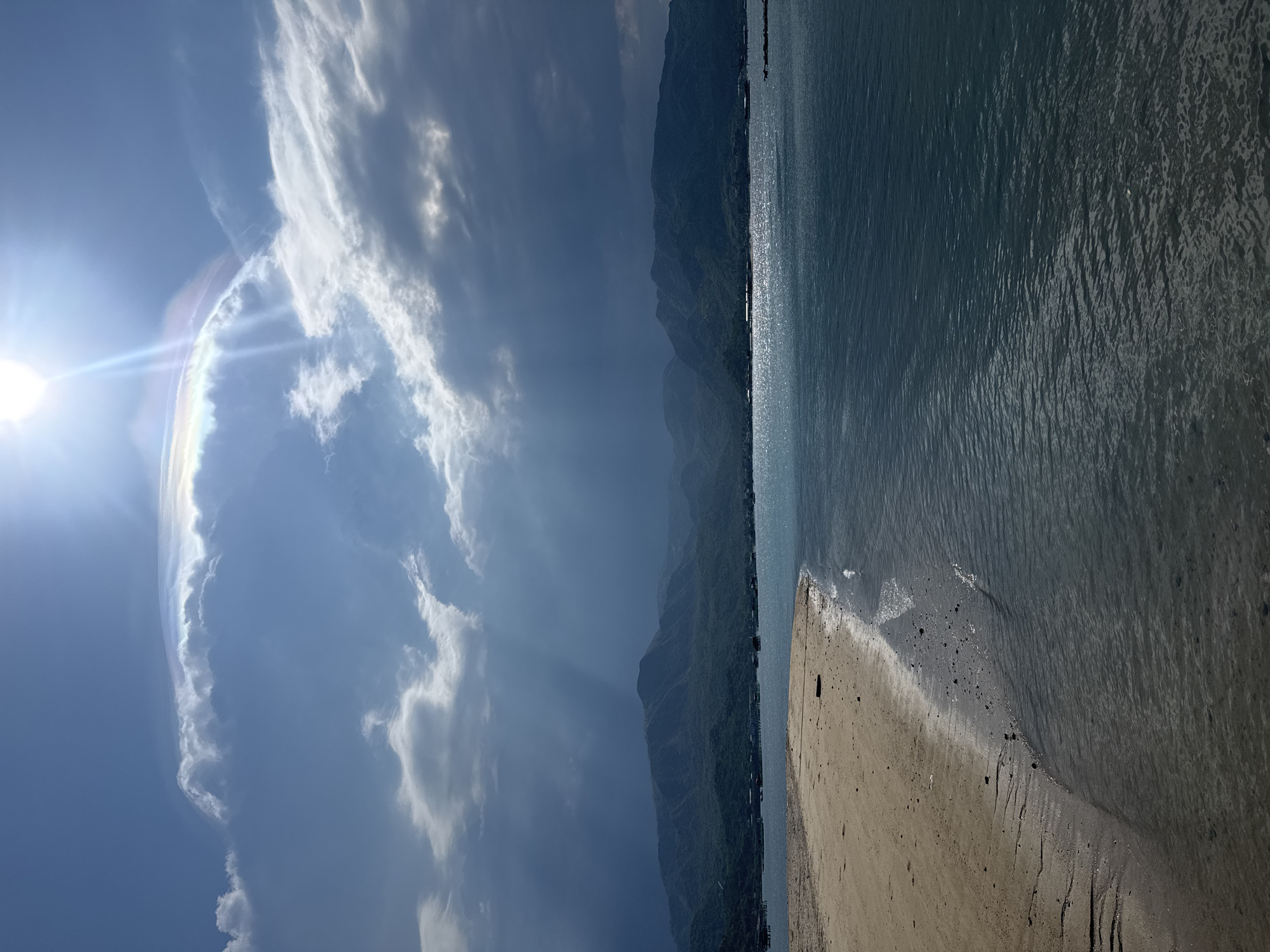 Sun halos over a tranquil Vietnamese beach morning