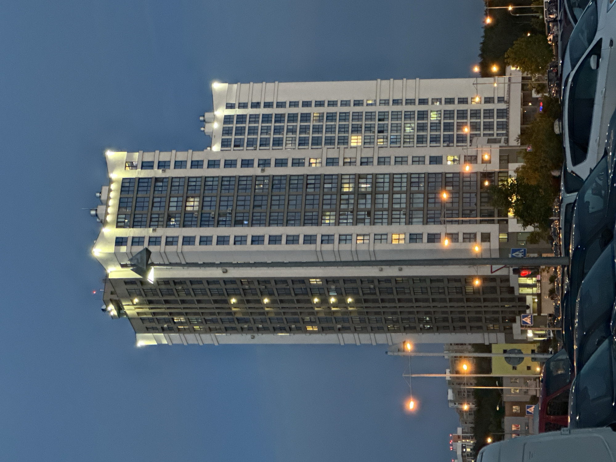 Evening architectural photography session captures modern Minsk buildings at twilight