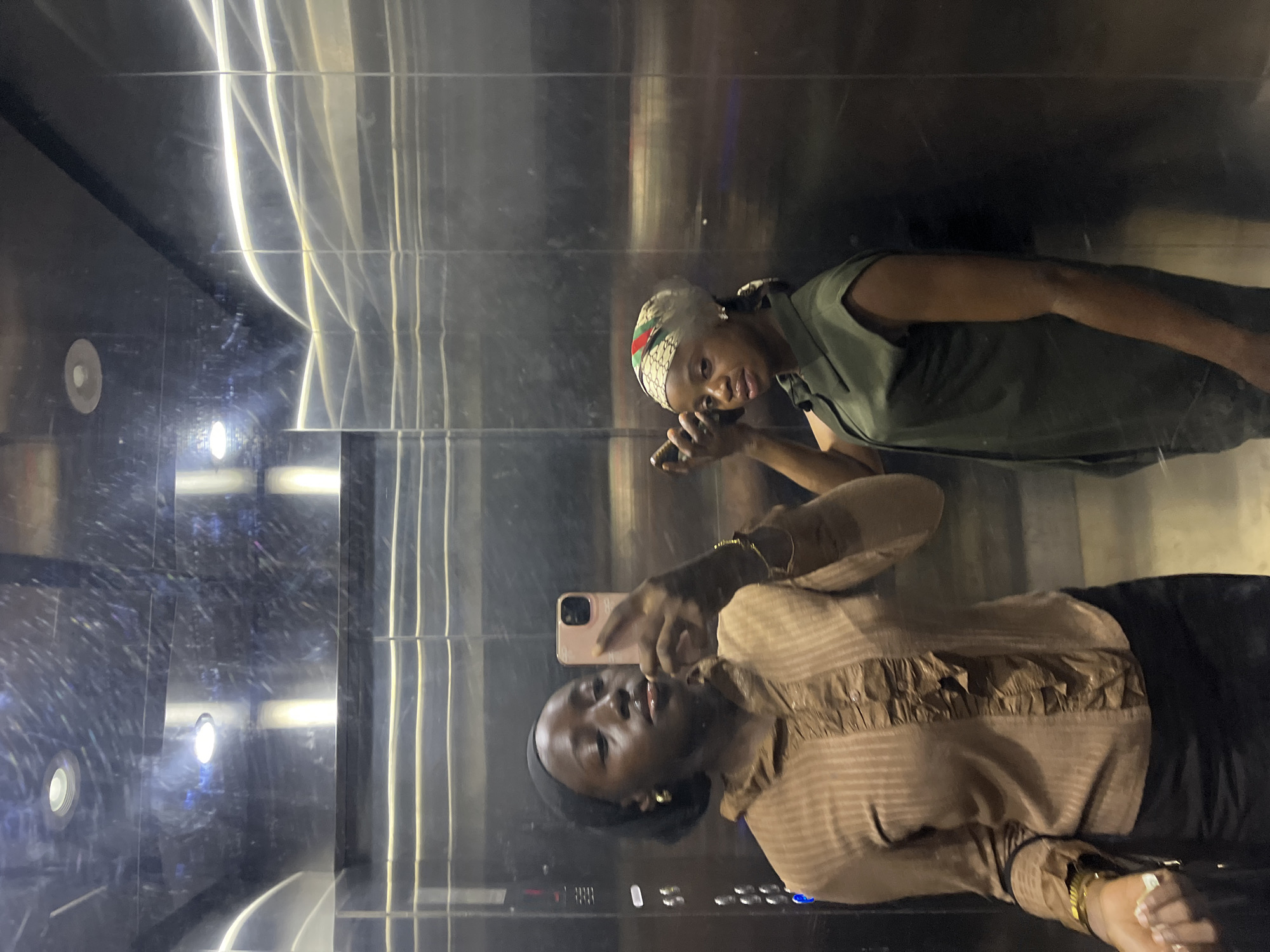Women take elevator selfie in Karum Nigeria morning