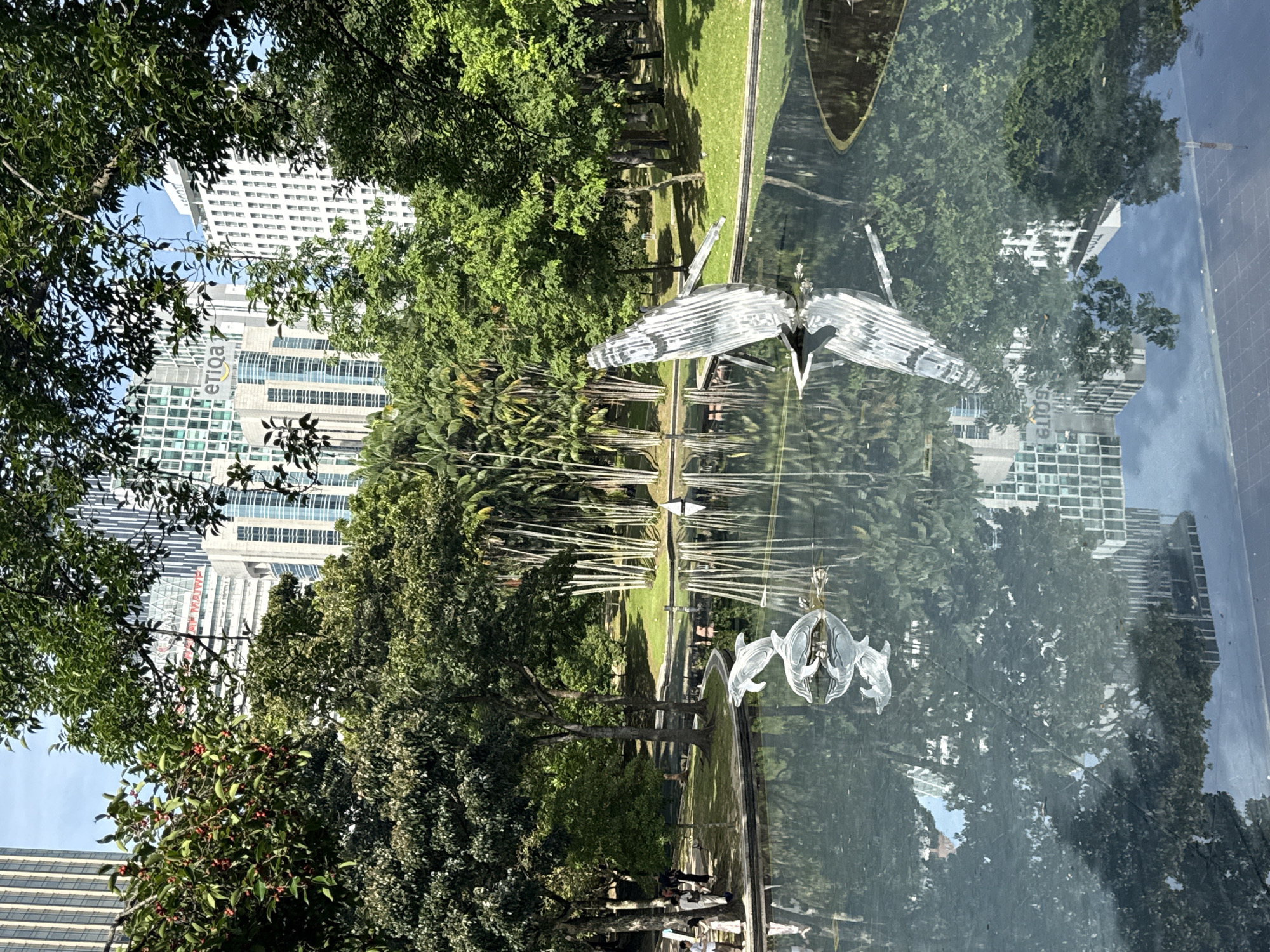 Late-night strollers enjoy Kuala Lumpur parks near Petronas Towers
