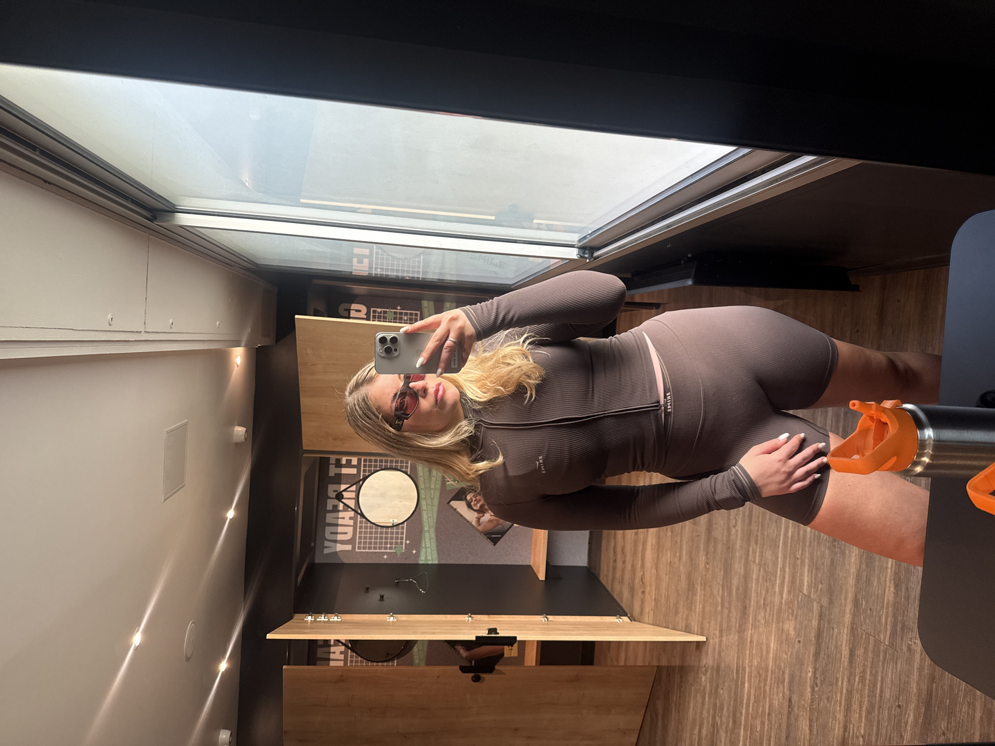 Woman takes mirror selfie in Paris apartment