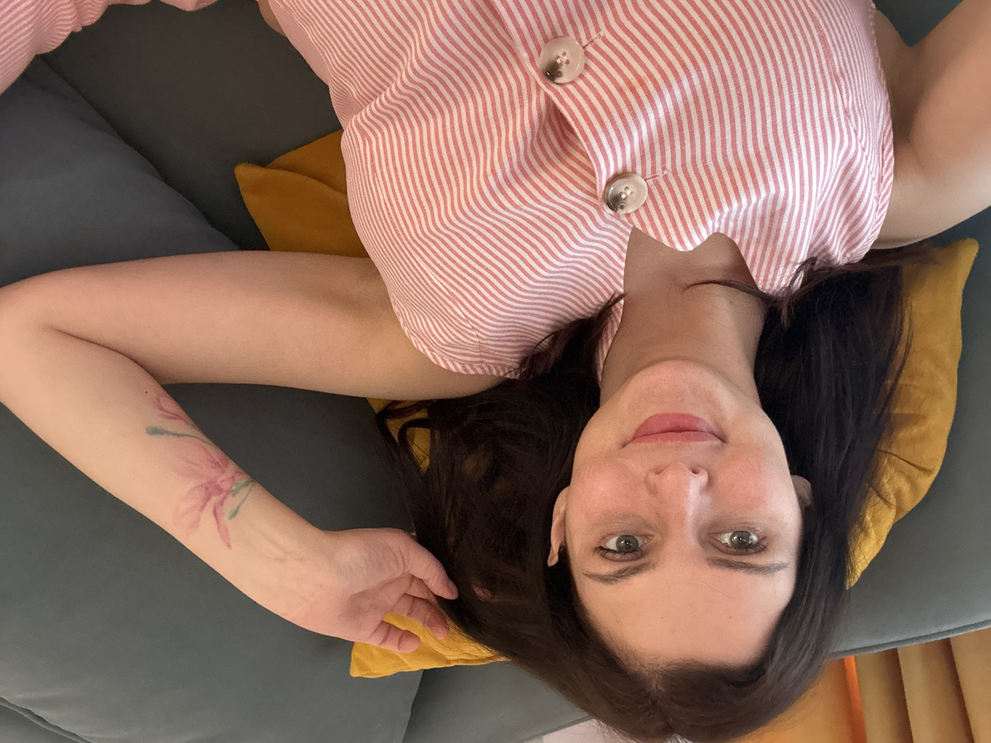 Lazy day selfies in pink striped pajamas, couch and mirror.