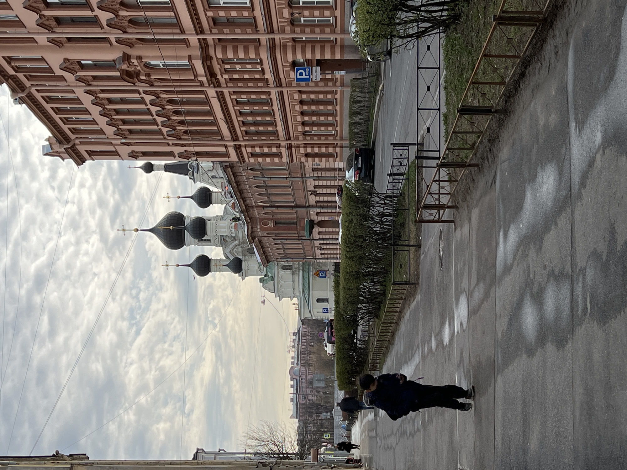 Everyday street life documented near Orthodox church in Saint Petersburg
