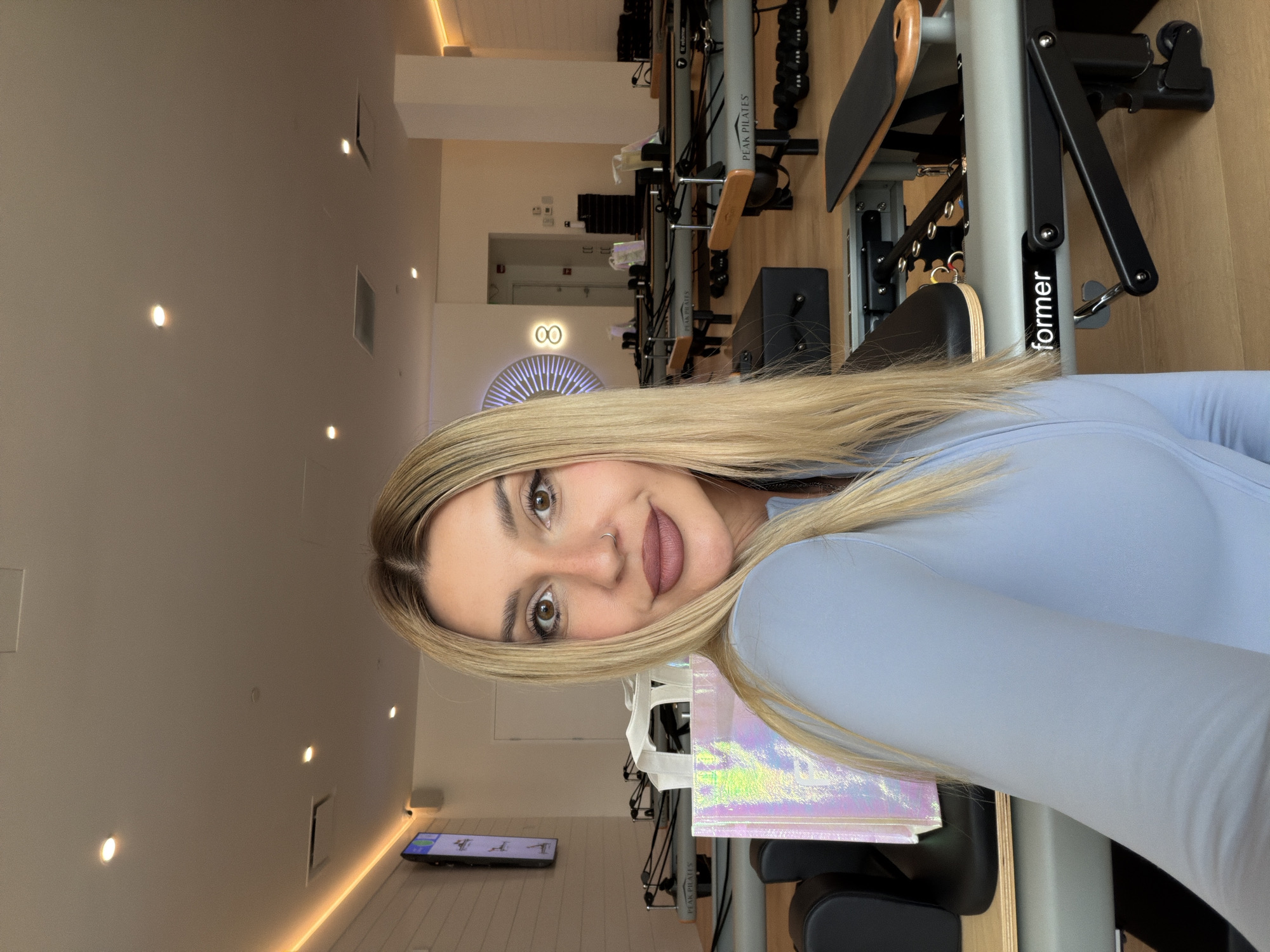 Inside a Calgary Pilates studio, reformers lined up and ready