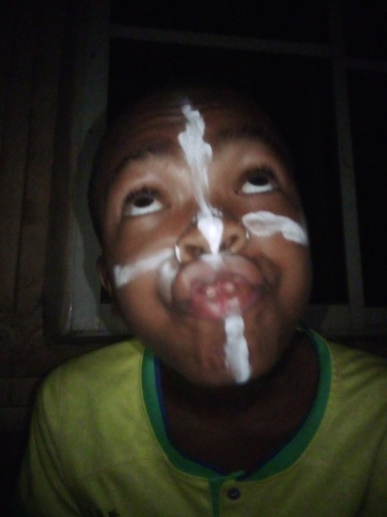 Child observed in playful moment during evening in Onitsha