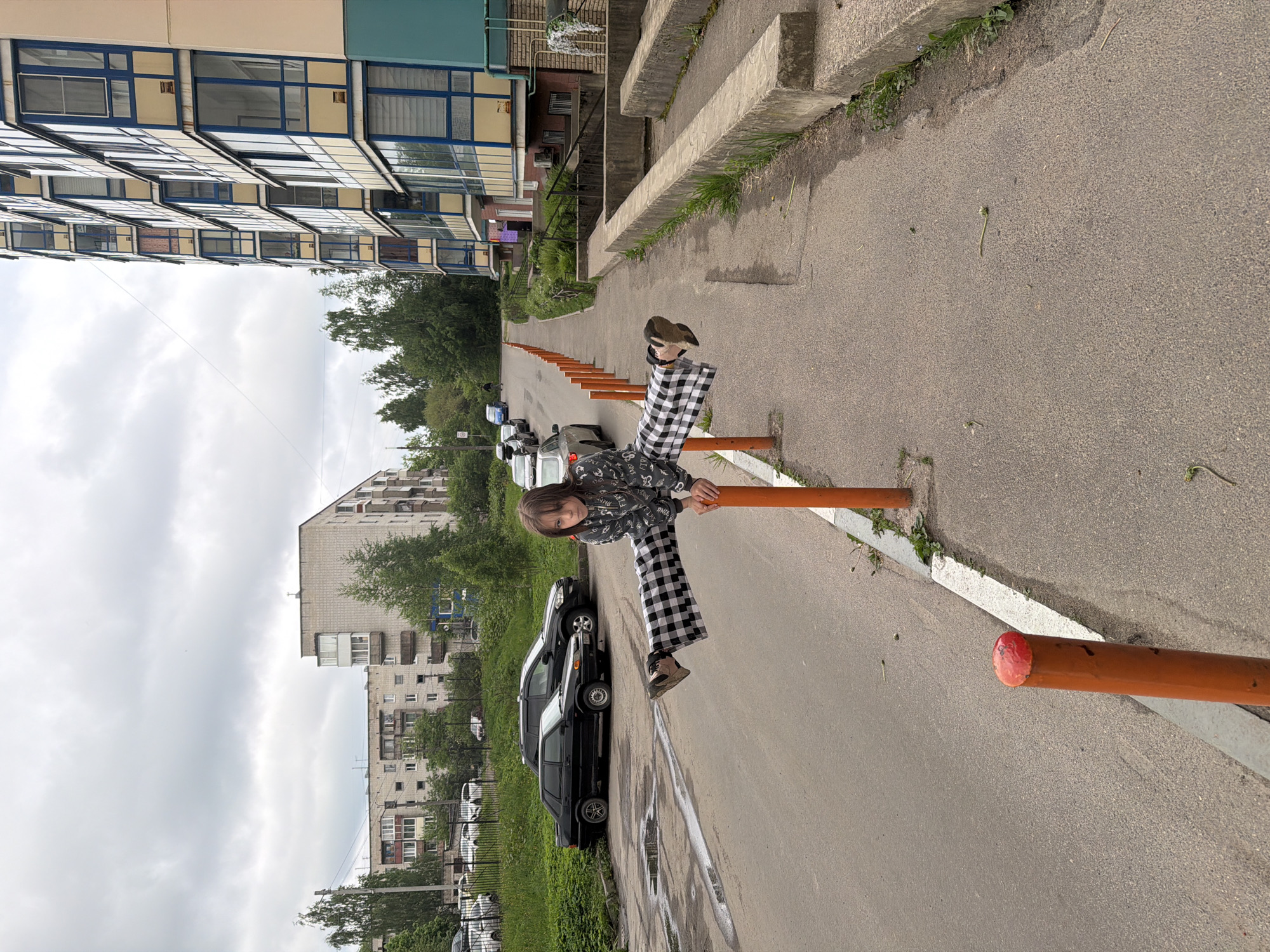 Child sits on road barriers in Tokkari-Lend, Russia