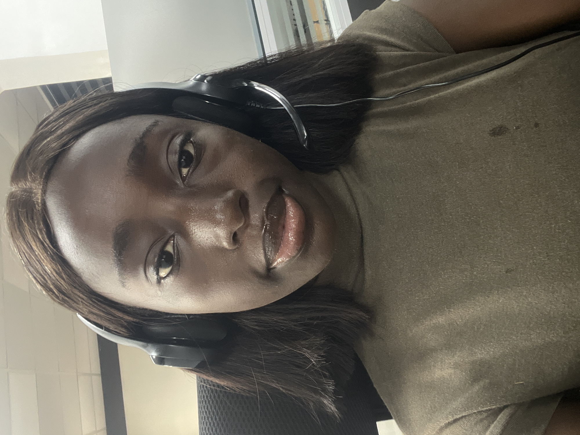 Woman working at office desk observed in Karum, Nigeria
