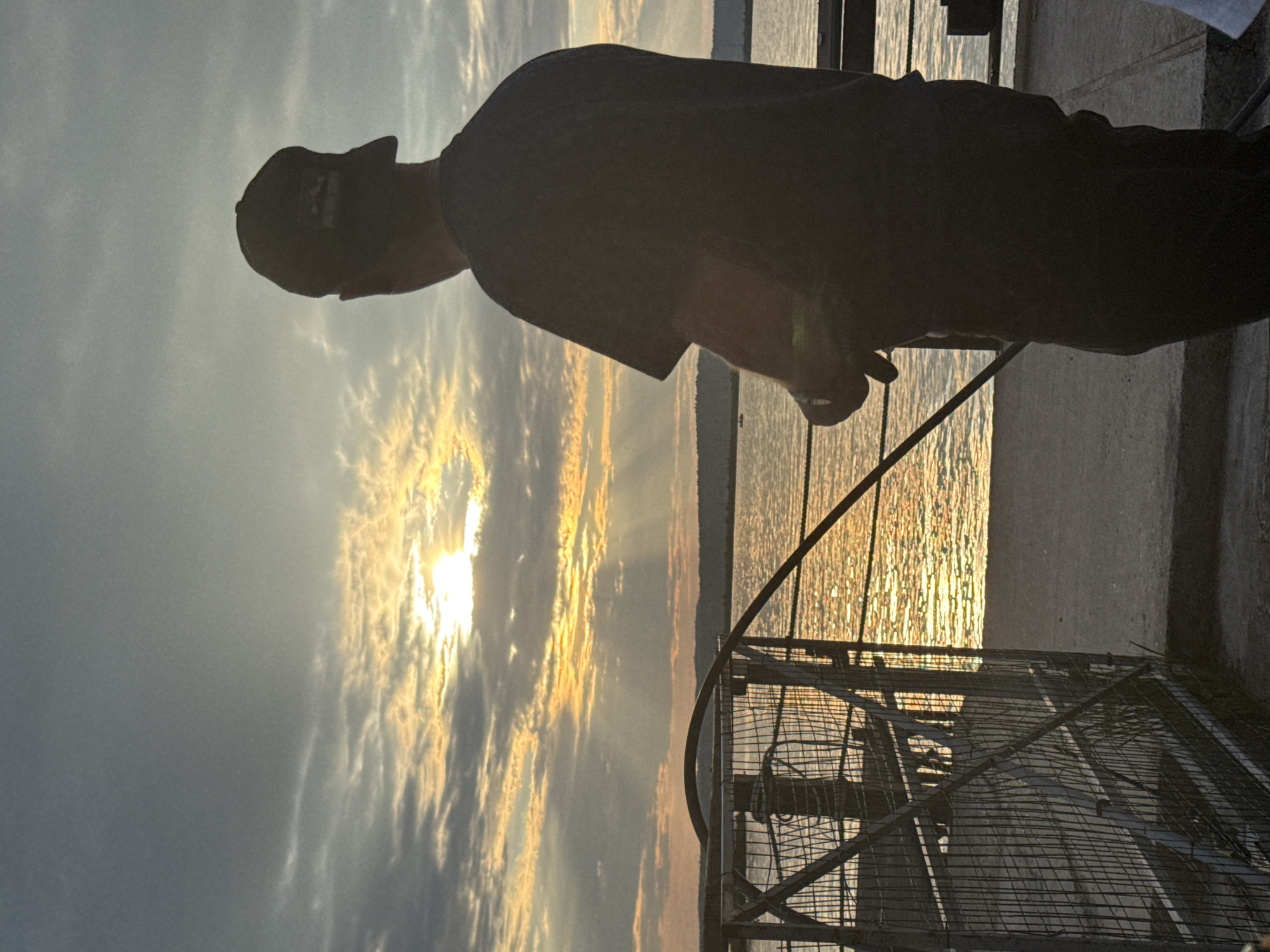 Sunset gathering documented along Kama River waterfront in Chaikovsky
