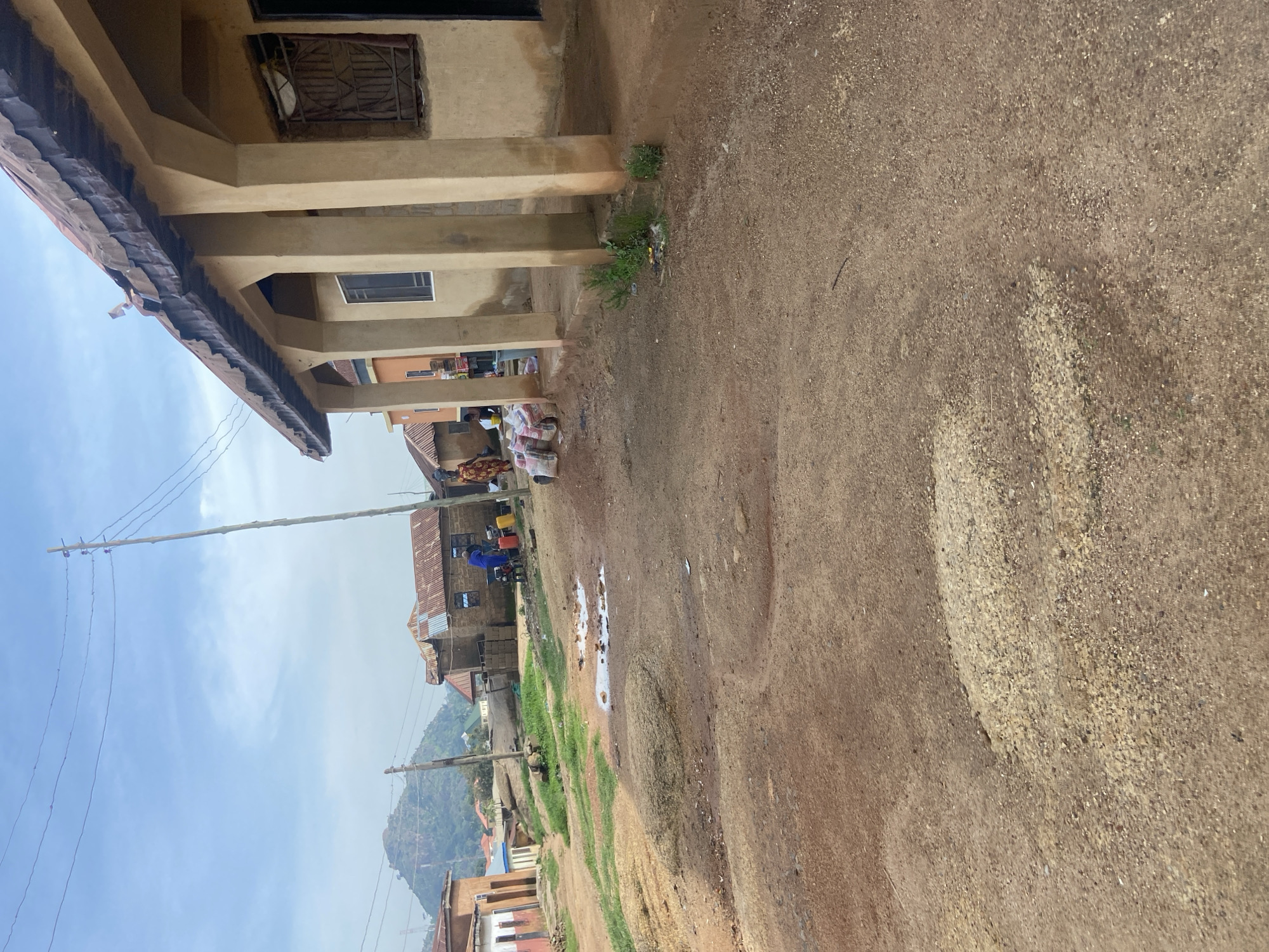 Street-level look at a Jos neighborhood's roads and buildings