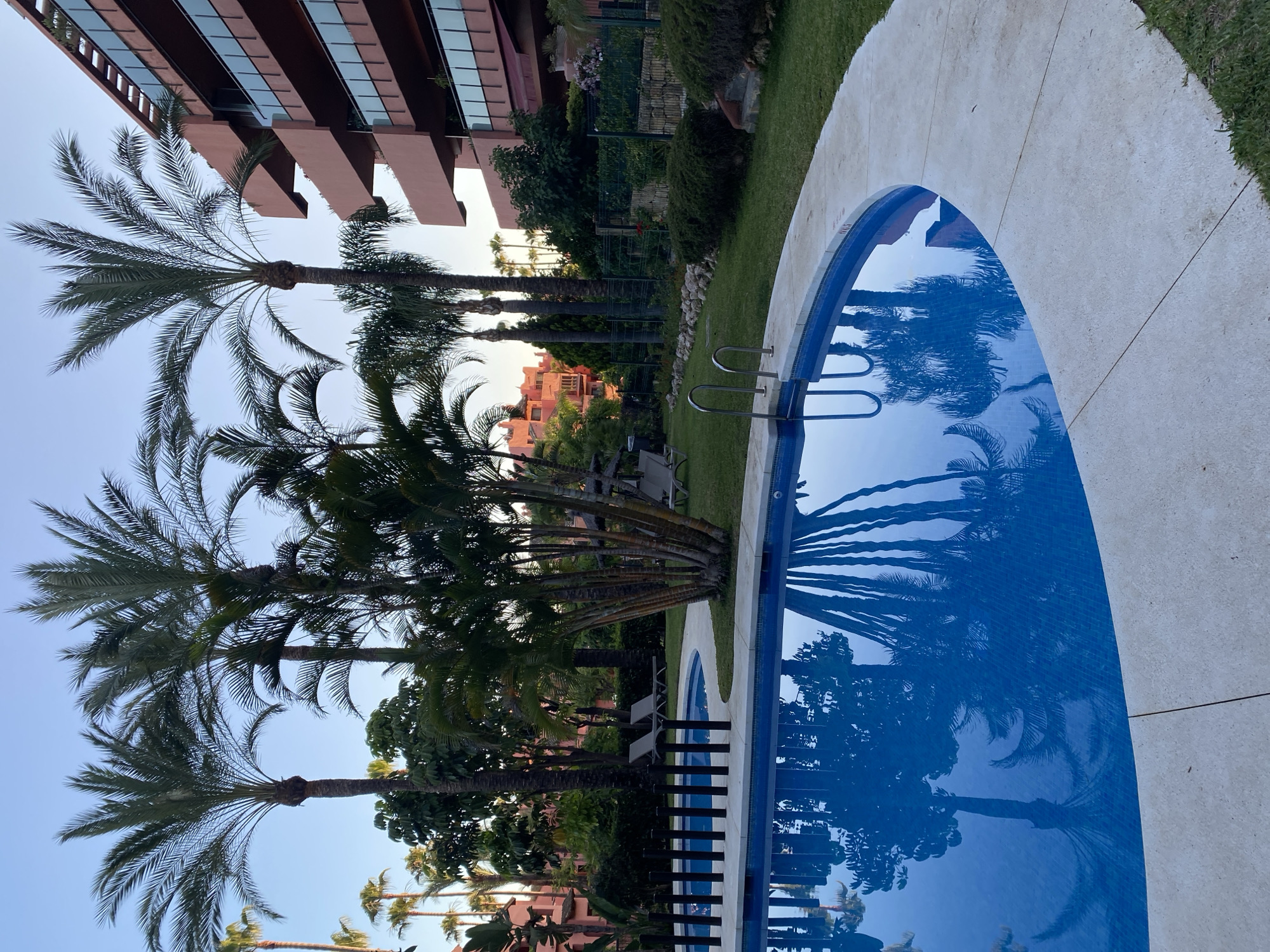 Poolside and garden details at a Costa del Sol resort, dusk