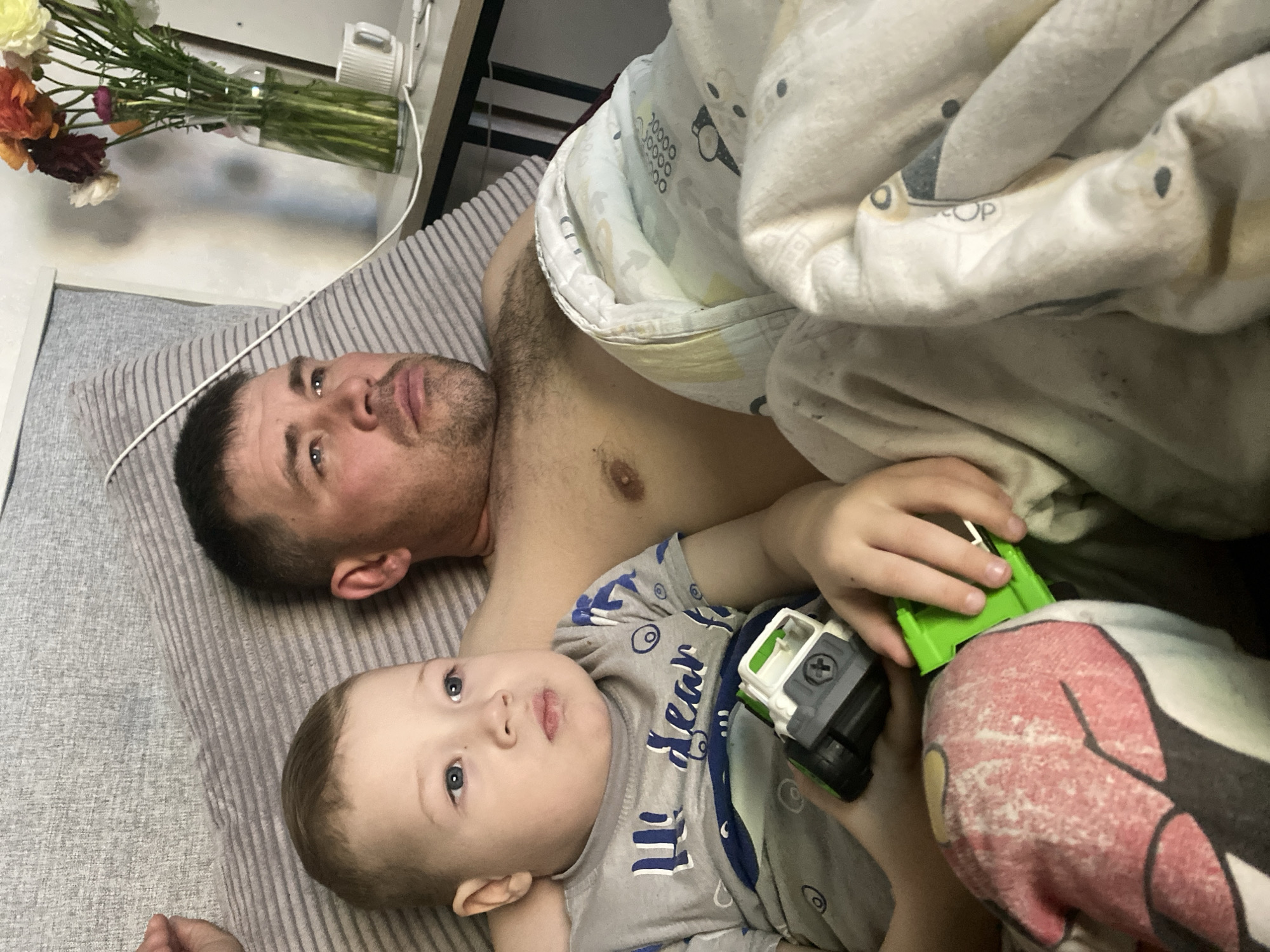 Father, child share quiet moments at Sochi home