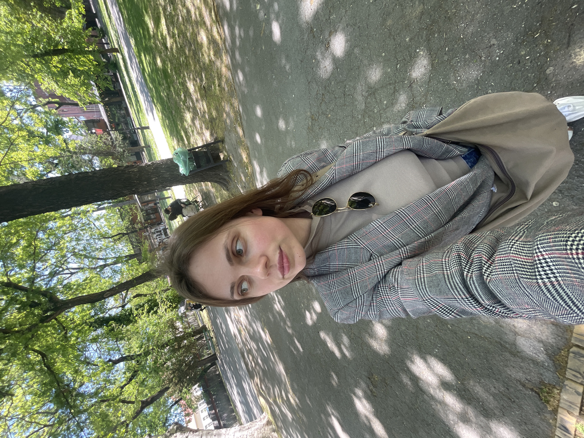 Woman photographs herself in Subotica park during morning outing