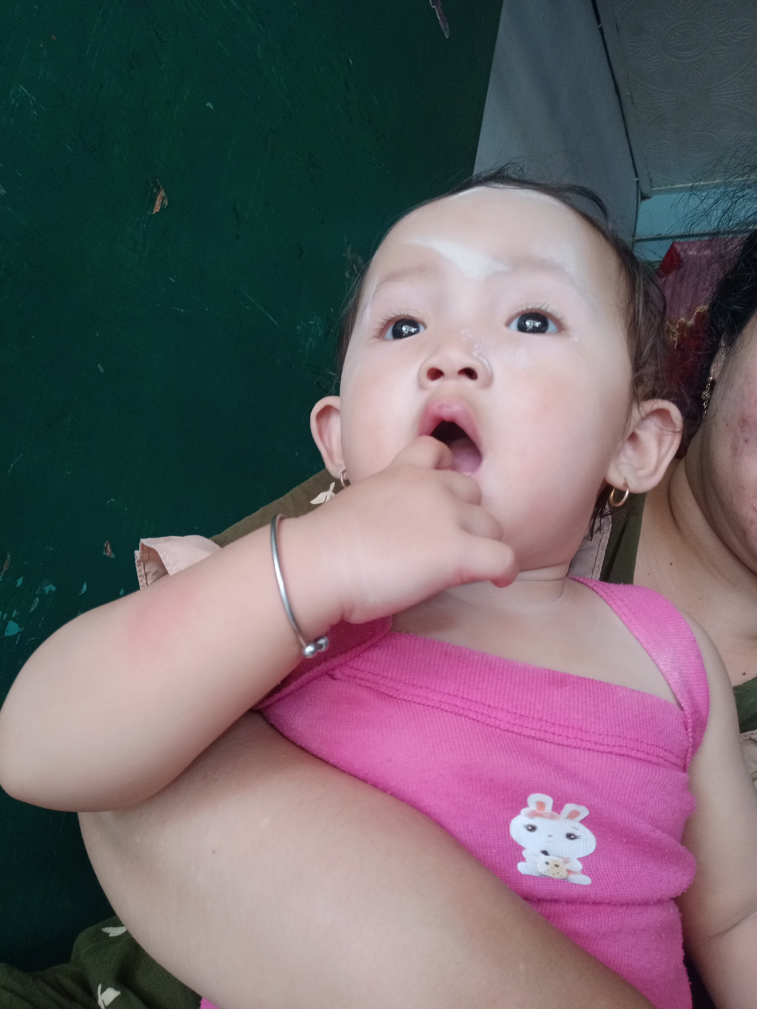 Young children documented in domestic scenes in Bungur, Indonesia