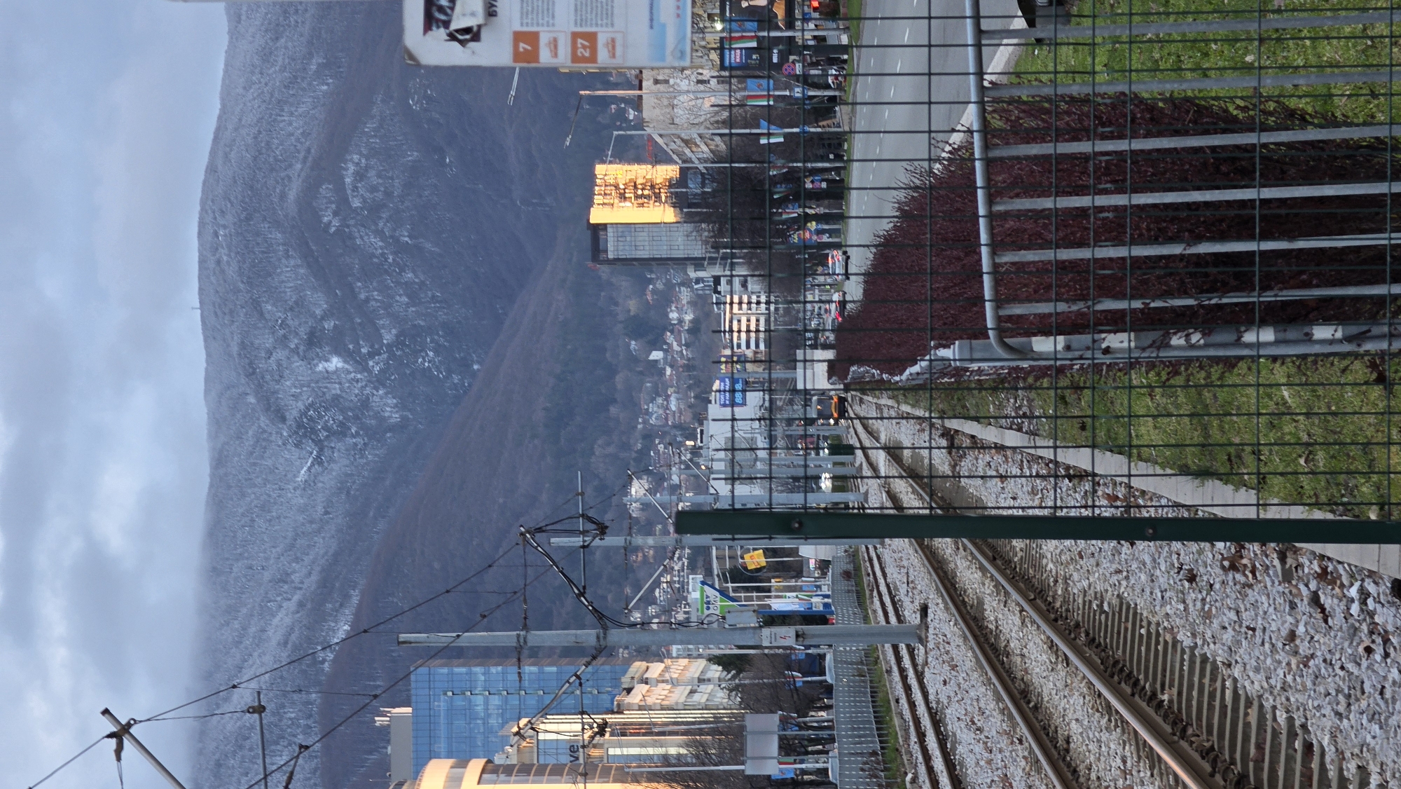Railway tracks and resting traveler documented in Sofia