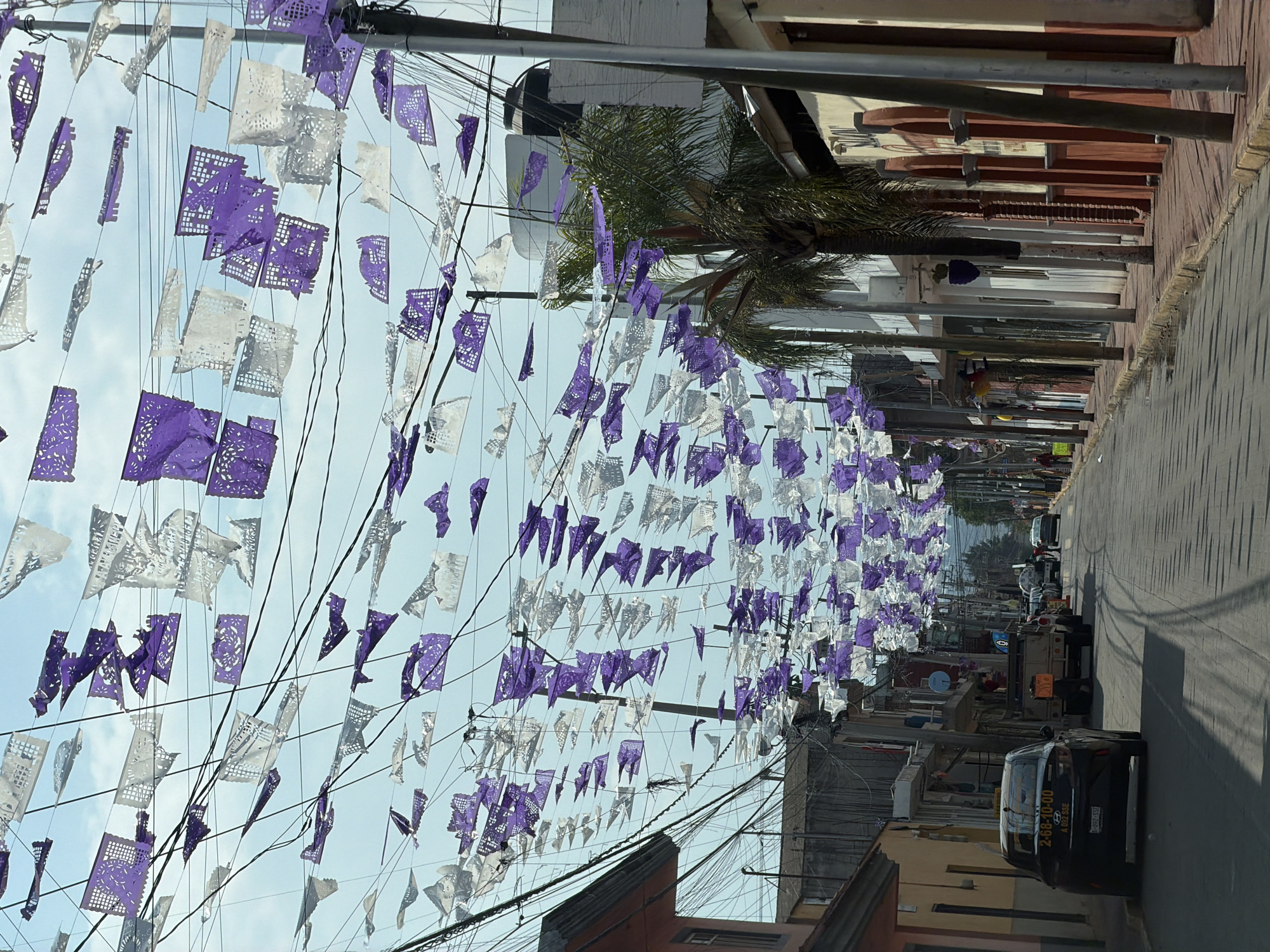 Papel picado banners decorate San Andrés Cholula street