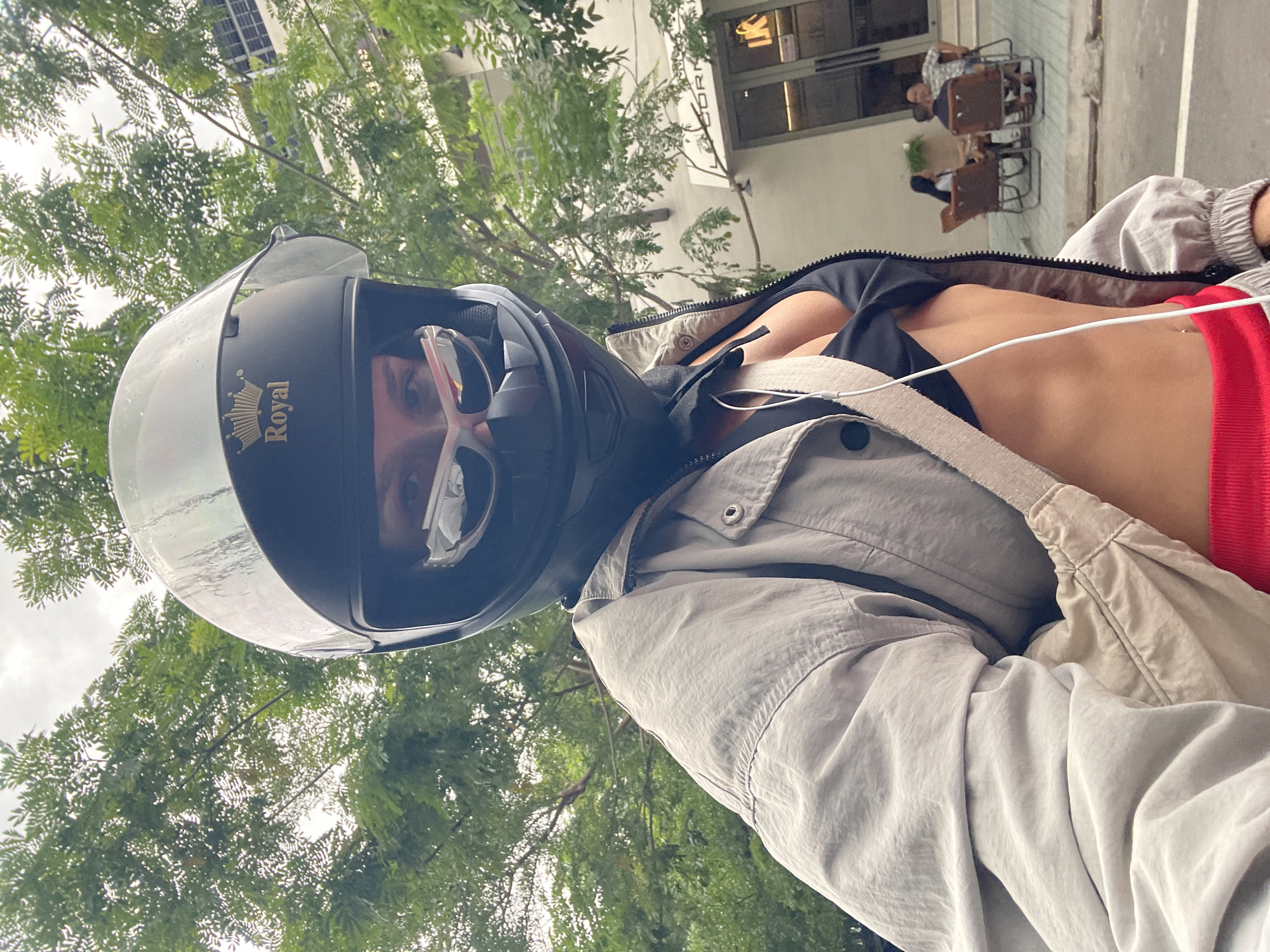 Helmeted rider geared up in Phu Thuy Ward, Vietnam