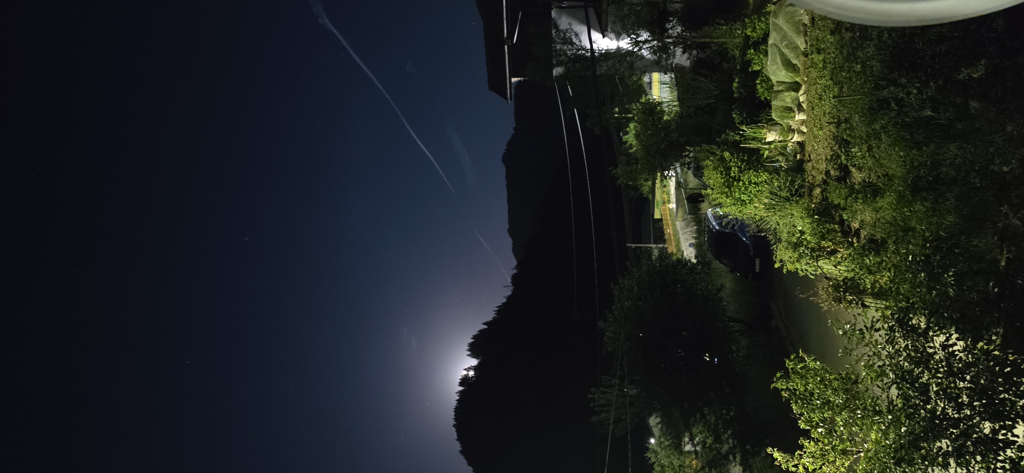 Nighttime rural landscape observed from elevated position in Rudozem