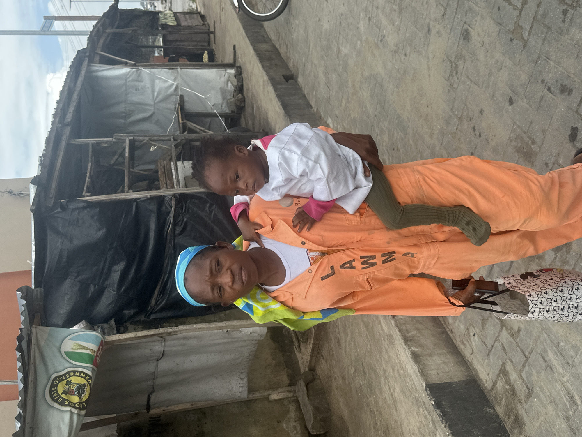 Everyday street life moving through Badagry on a July morning