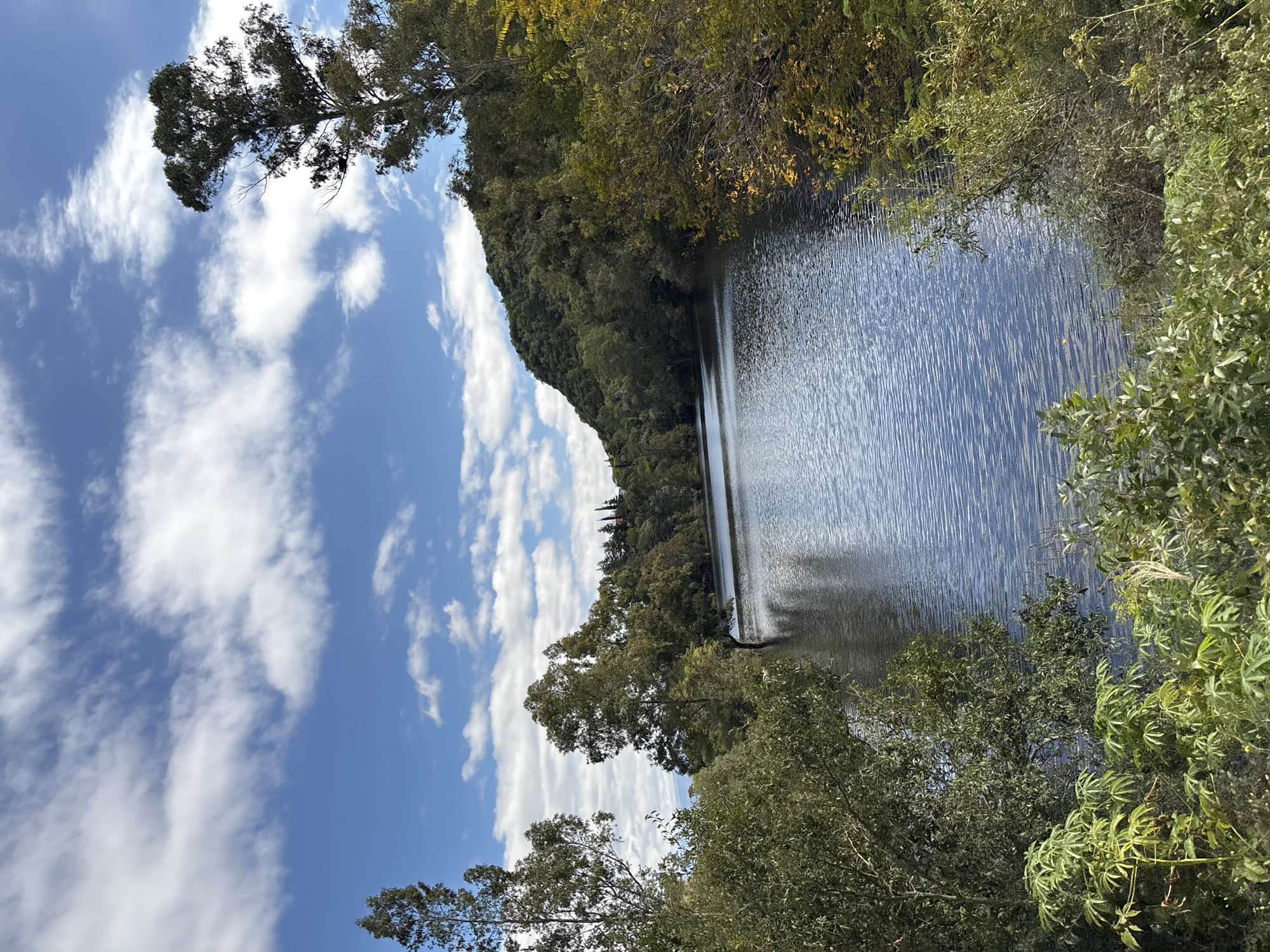 Motorcycle rider captures scenic lake views in Argentine village