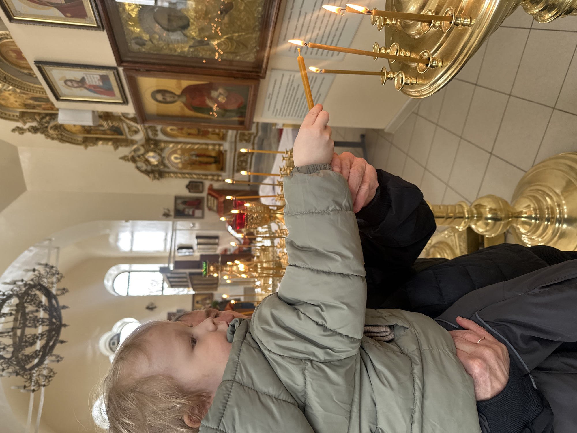 Child participates in Orthodox church rituals in Votkinsk Russia