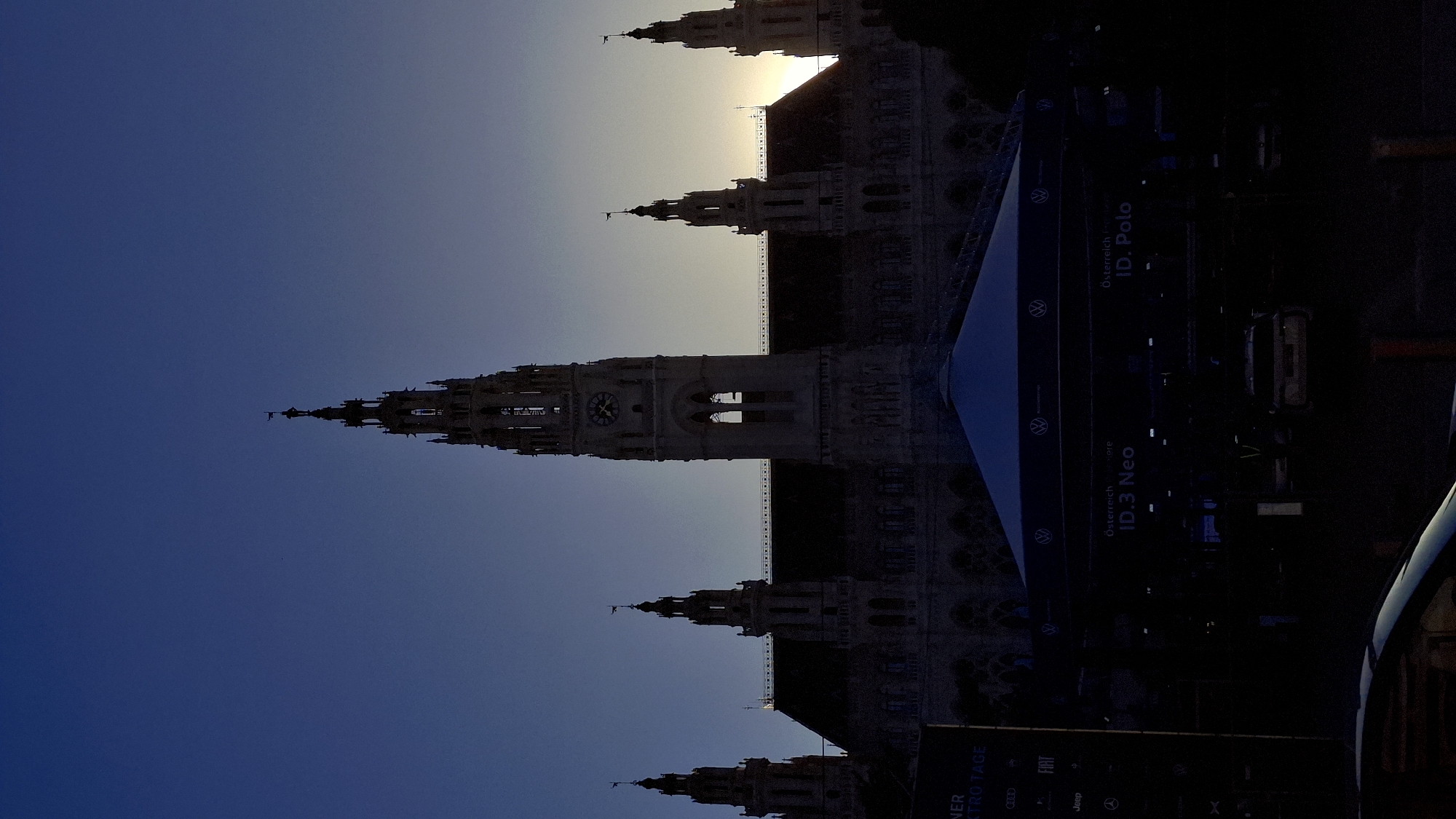 Evening scenes captured around Vienna City Hall, horse carriage spotted
