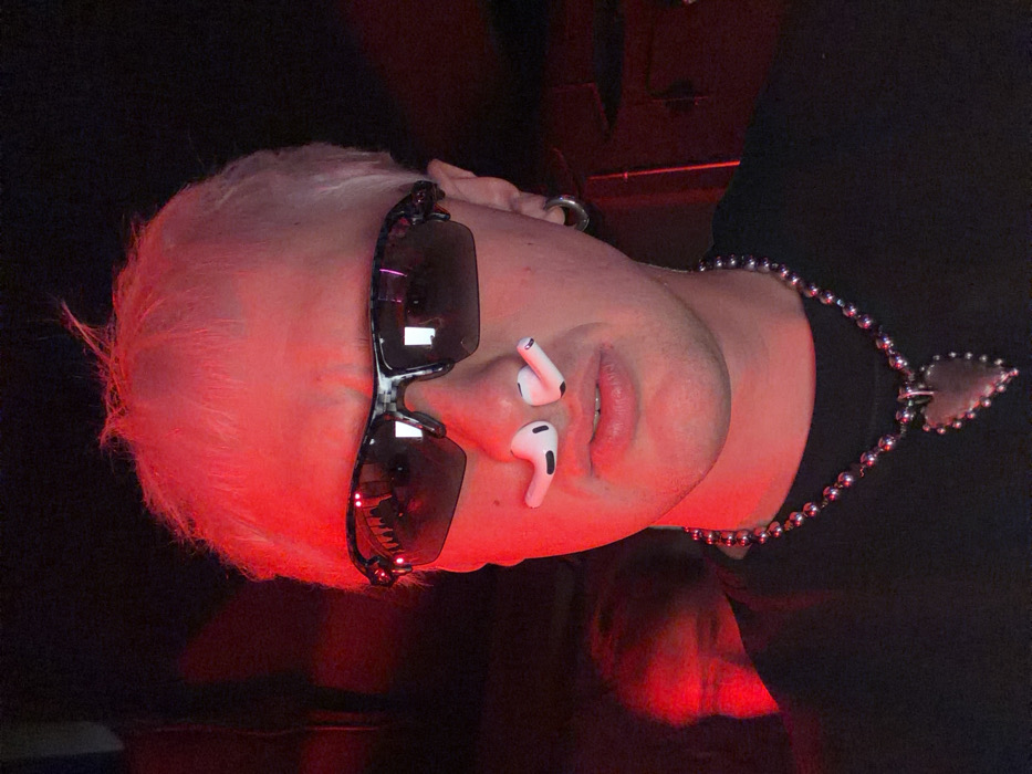 Moscow DJ Event Features Red-Lit Venue, Dancing Crowds
