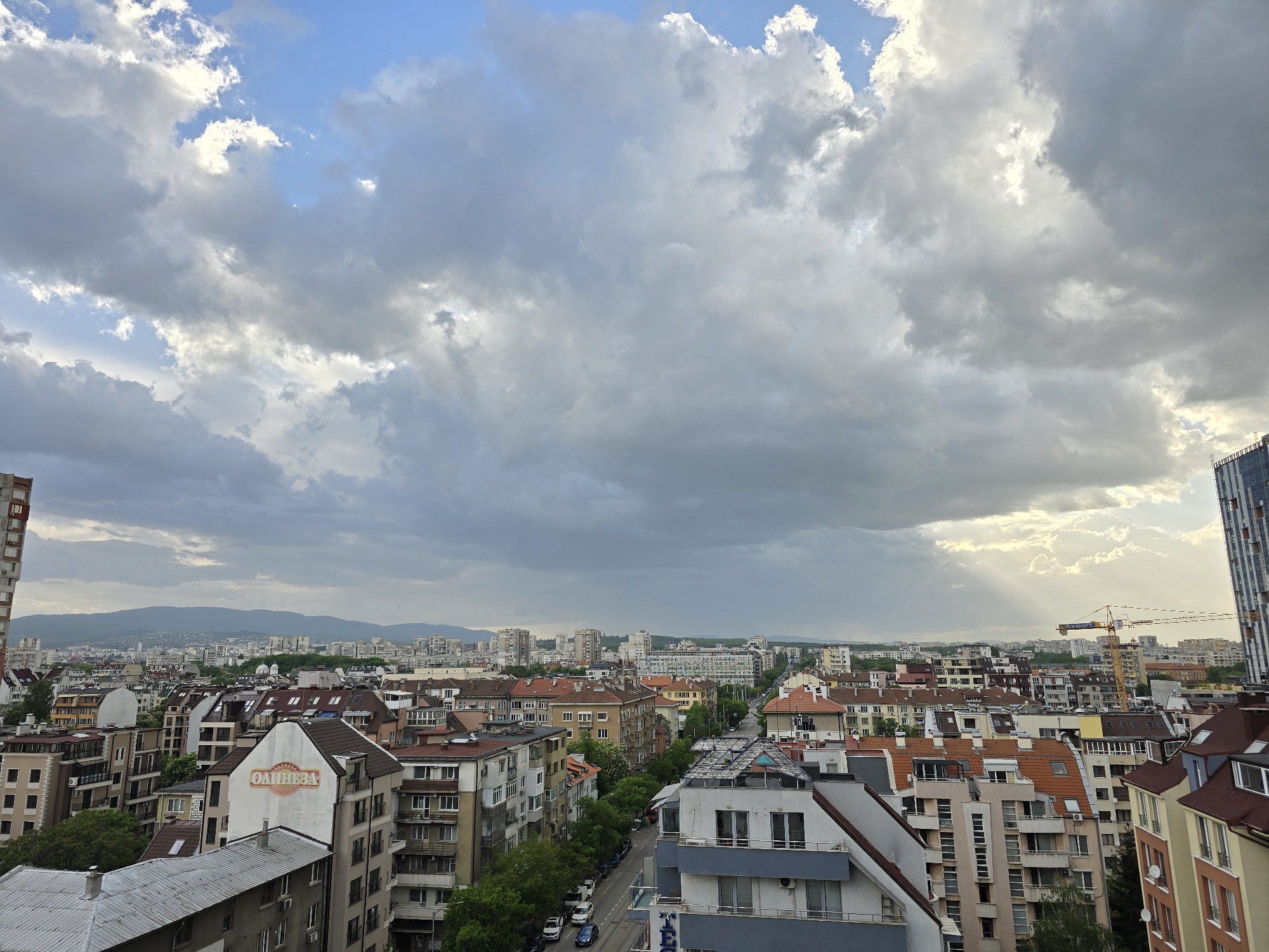 Sofia cityscape observed under dramatic clouds from elevated vantage point