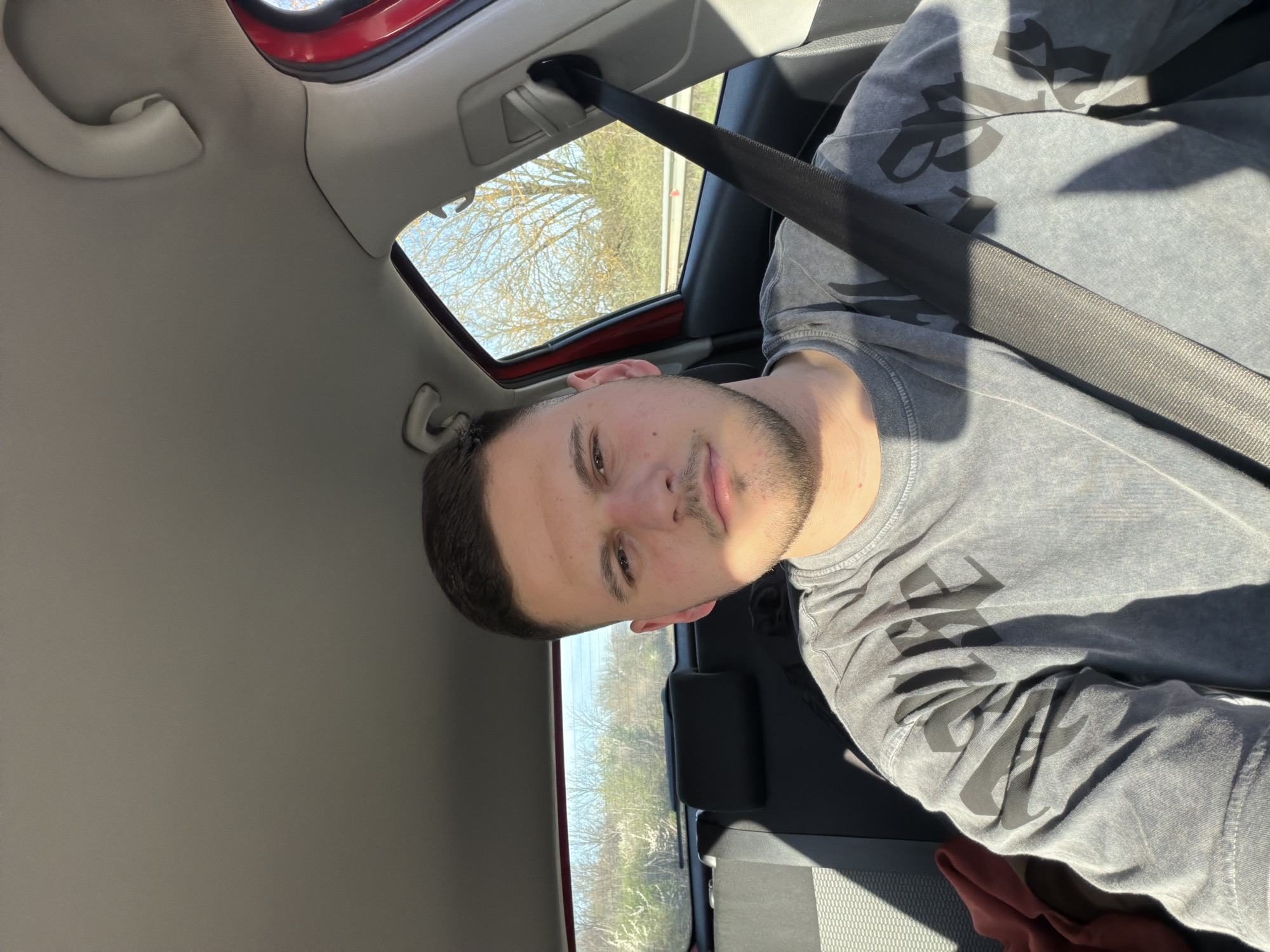 Young driver photographed in car interior in Blagovo, Bulgaria