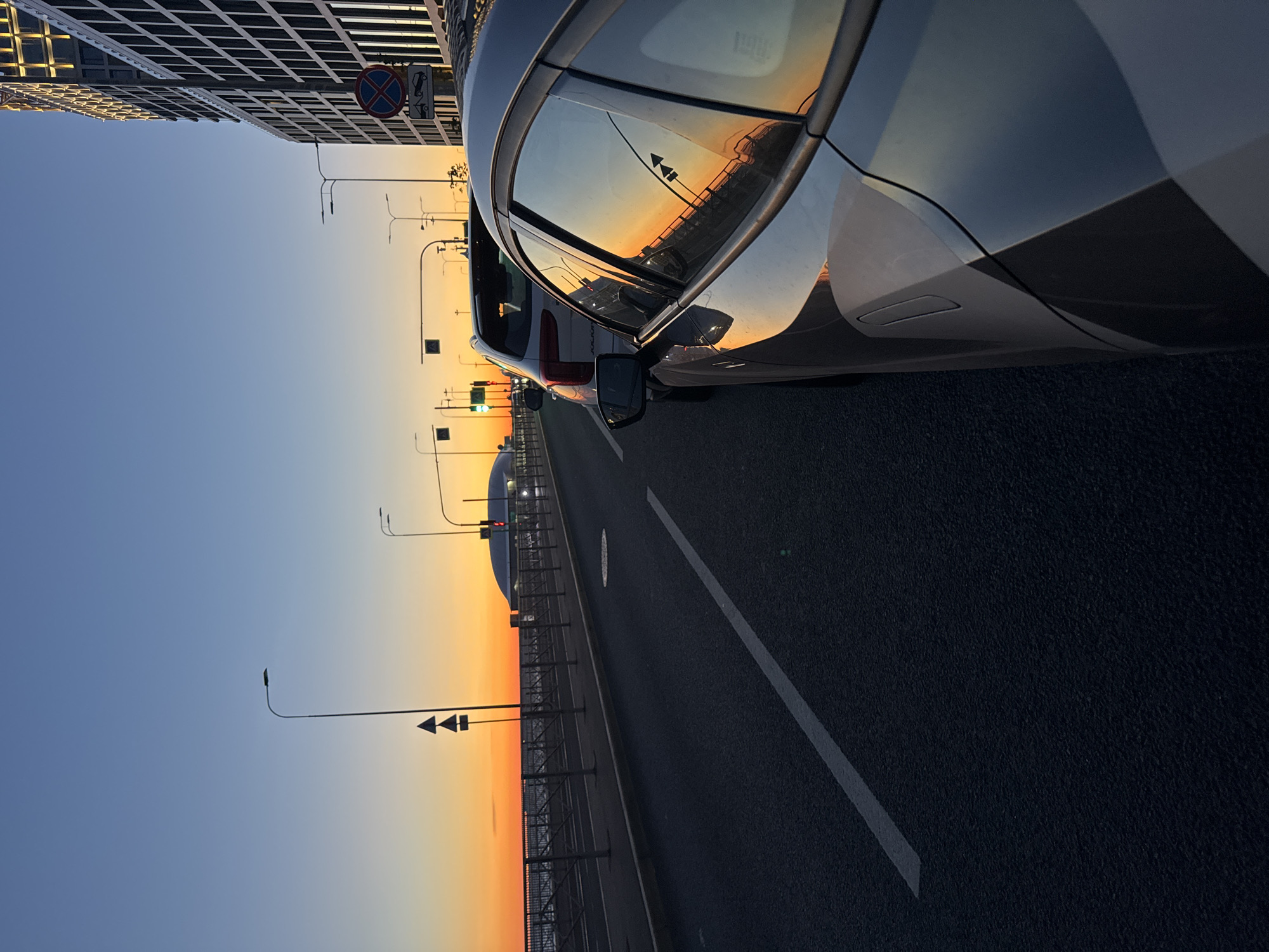 Saint Petersburg street glows under a vivid summer sunset
