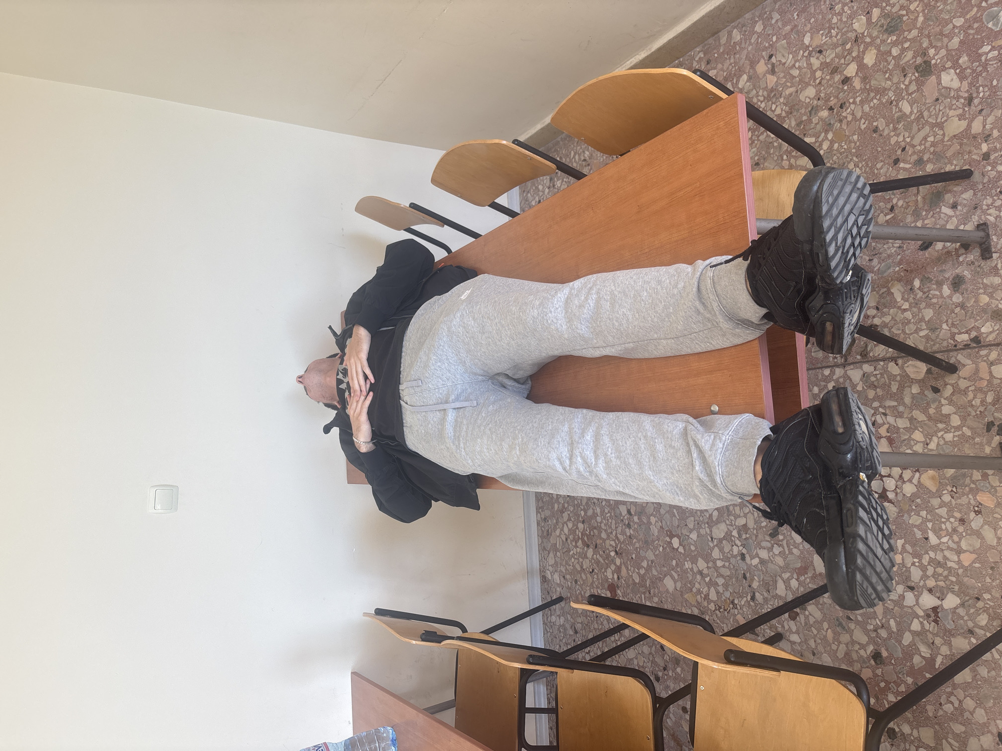Student lies upside down on classroom desk in Plovdiv