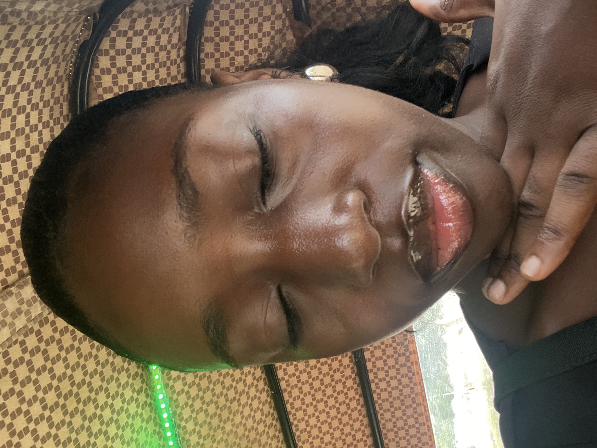 Woman rests on checkered surface in Abuja