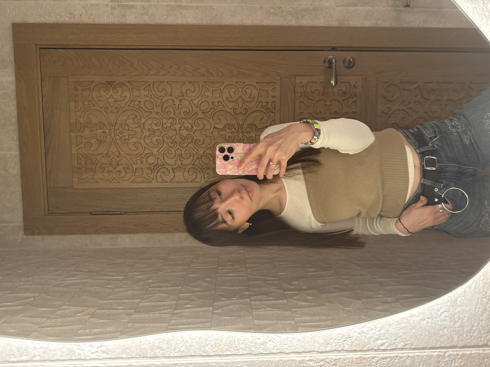 Woman takes bathroom mirror selfie in Kazan