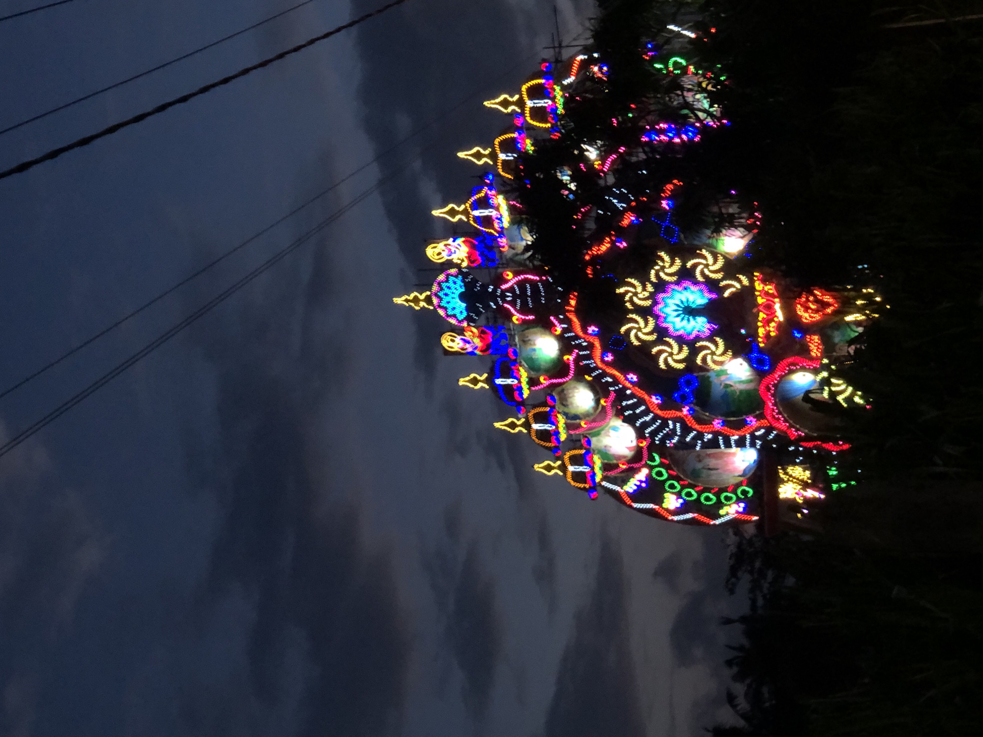 Ornate illuminated festival structure glowing in Habaraduwa, Sri Lanka